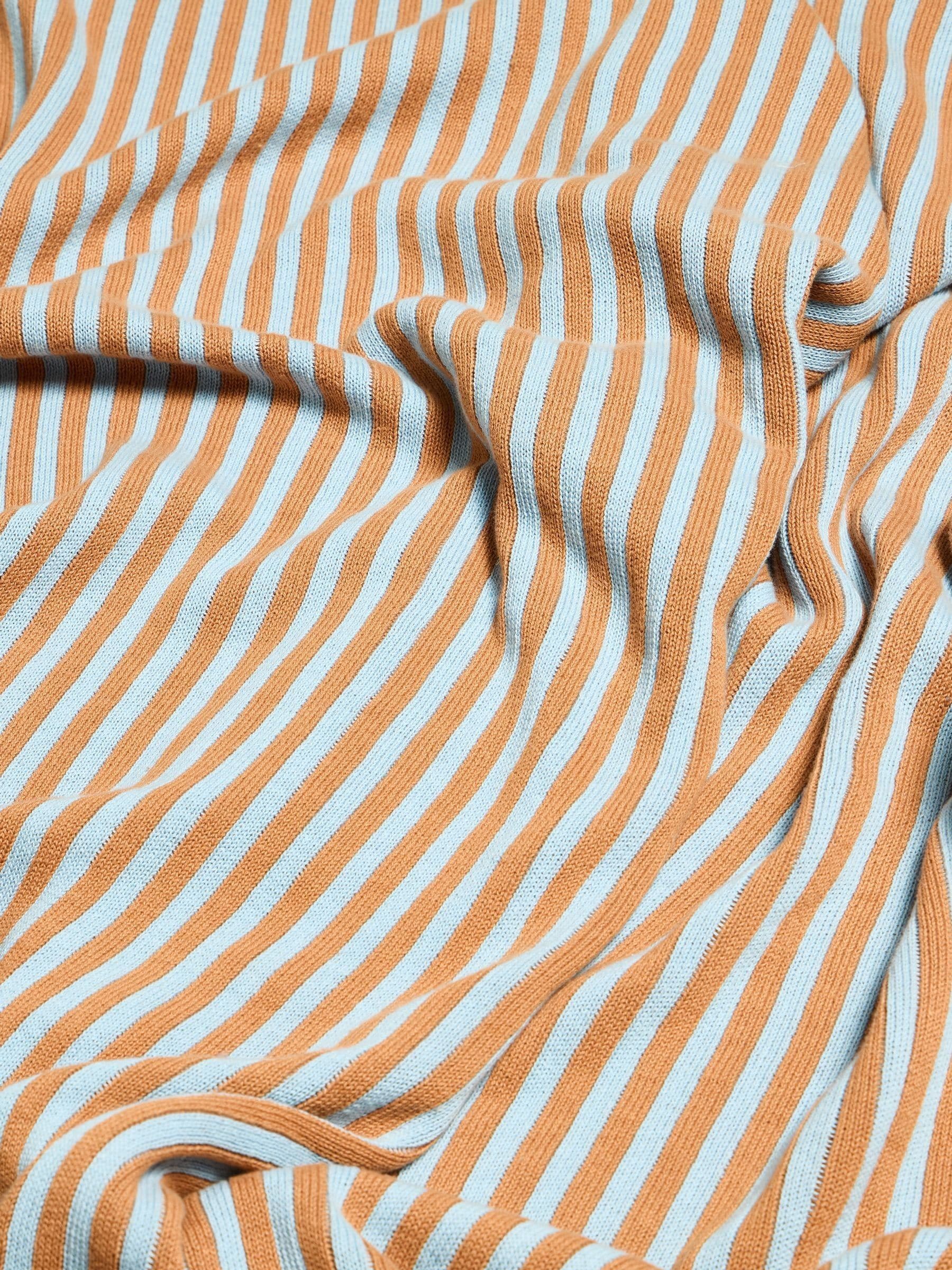 Oliver Bonas blue terracotta stripe knitted throw, UK version