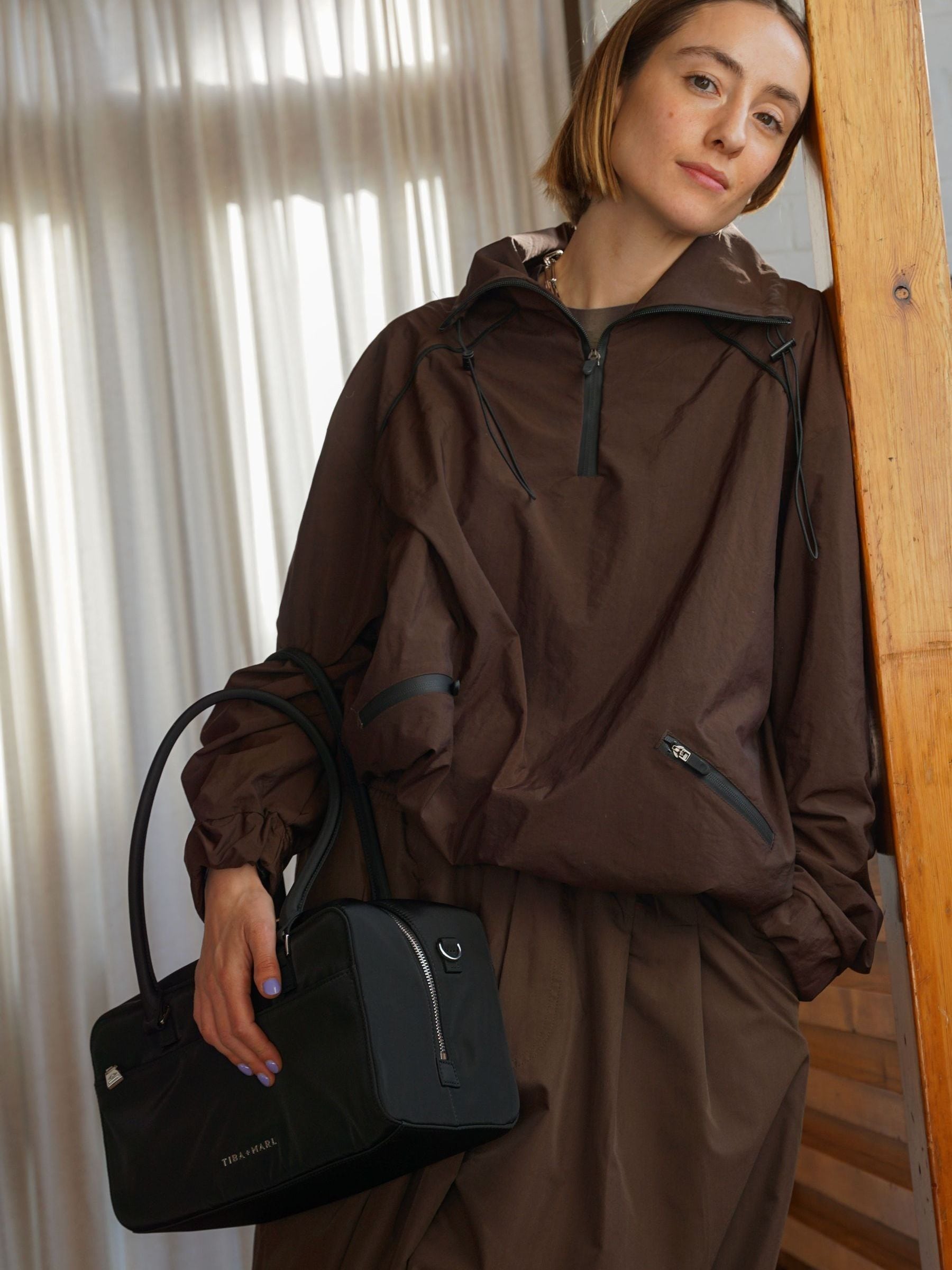 Tiba + Marl Black compact East West bag, imported from the UK