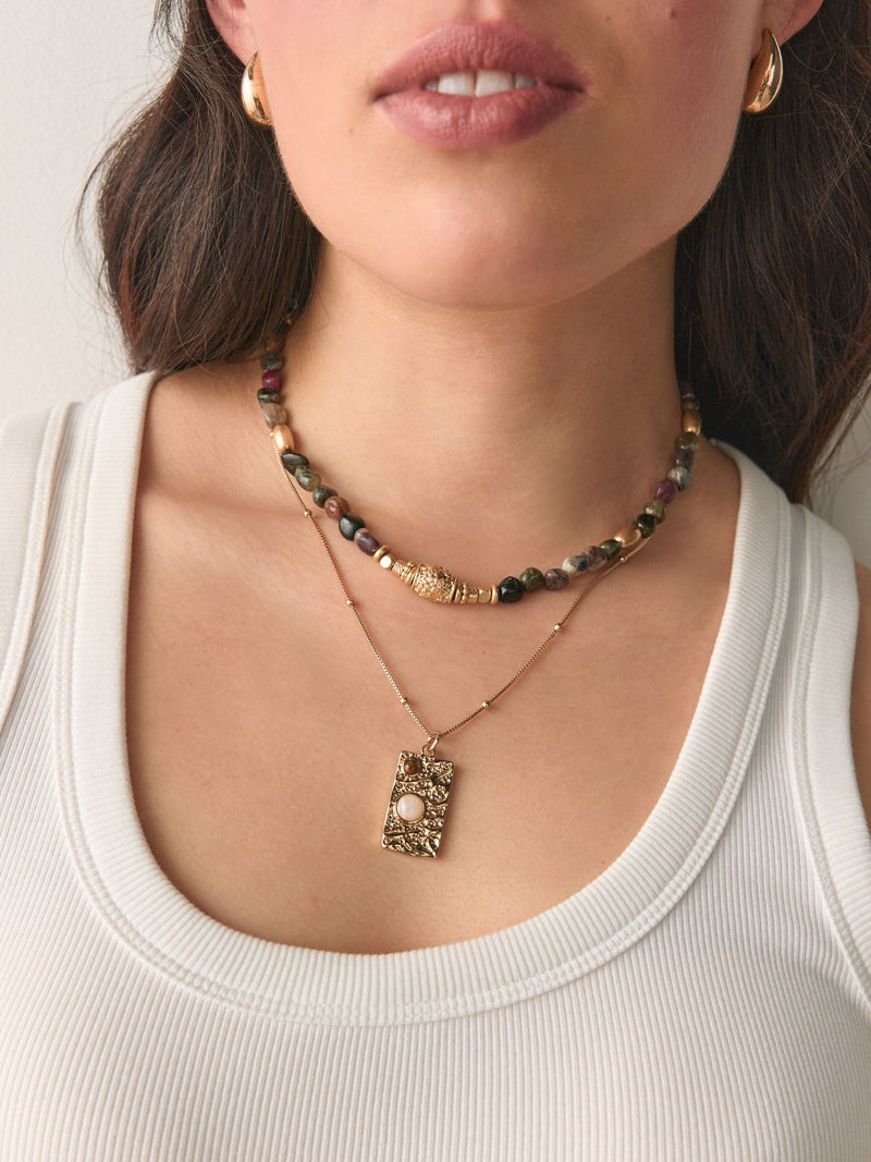 Semi-precious stone two-layer necklace with gold tone pendant, imported from the UK