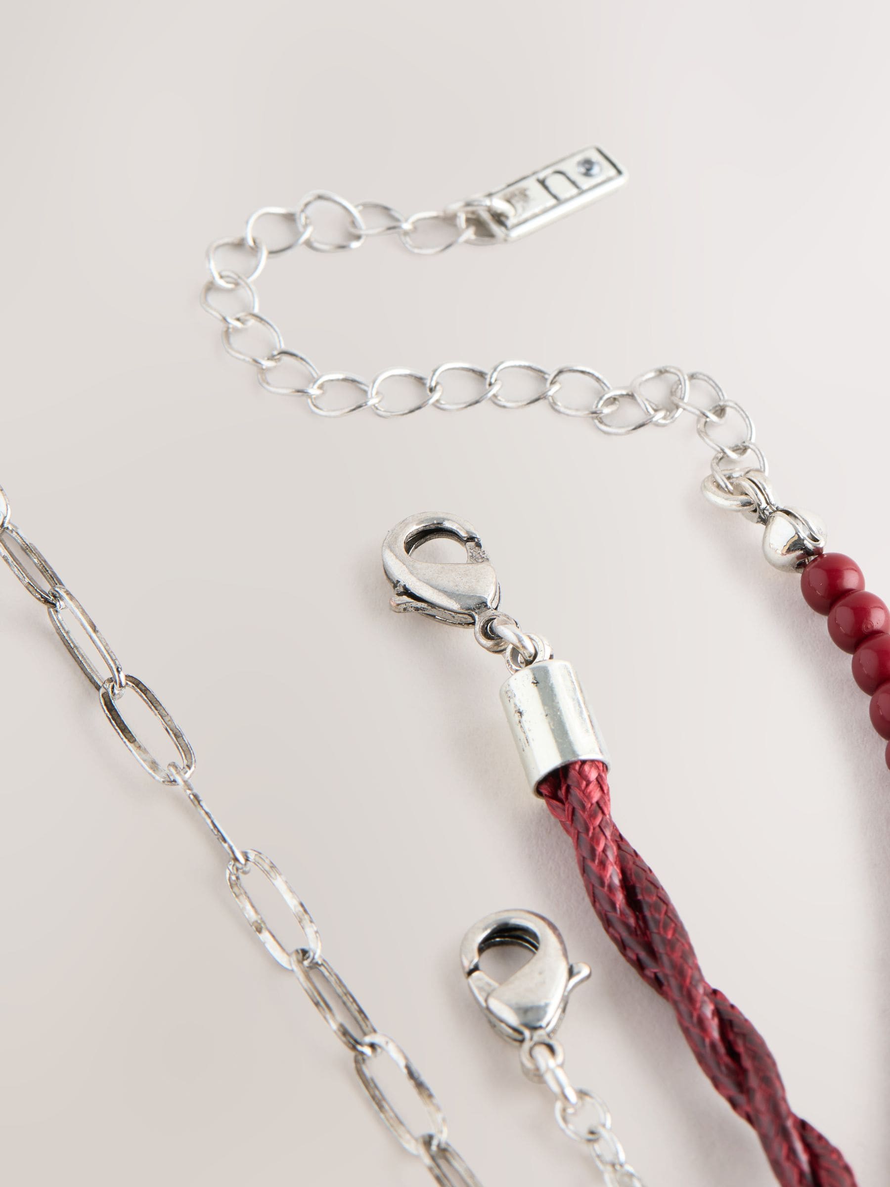 Red/Silver Cord Charm 4 Layer Necklace, imported from the UK