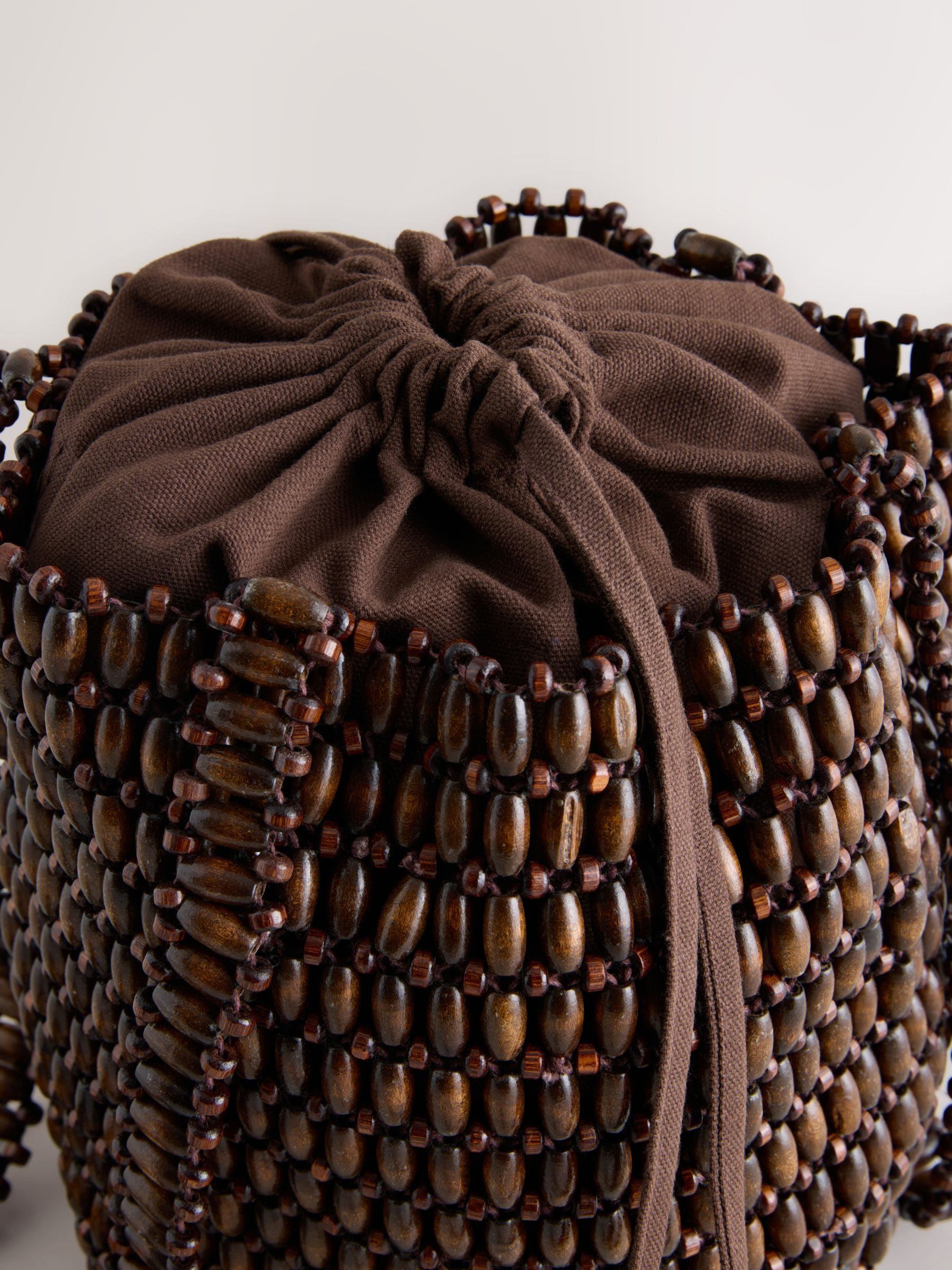 Wooden beaded shoulder bag in chocolate brown, imported from the UK