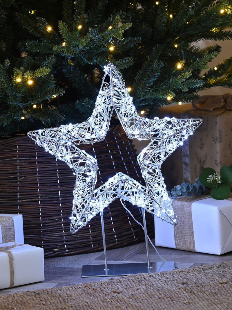 Festive 45cm lit silver shimmer star on stand with white LEDs, imported from the UK