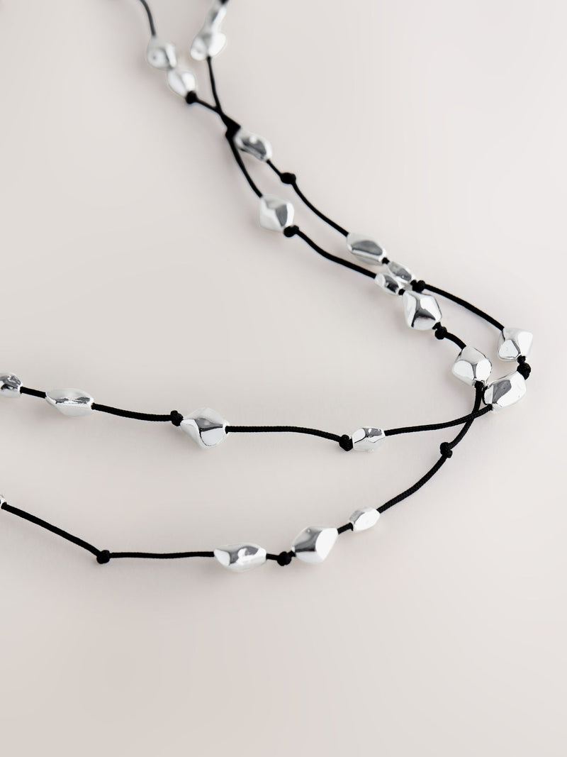 Silver tone beaded cord long necklace (British brand)