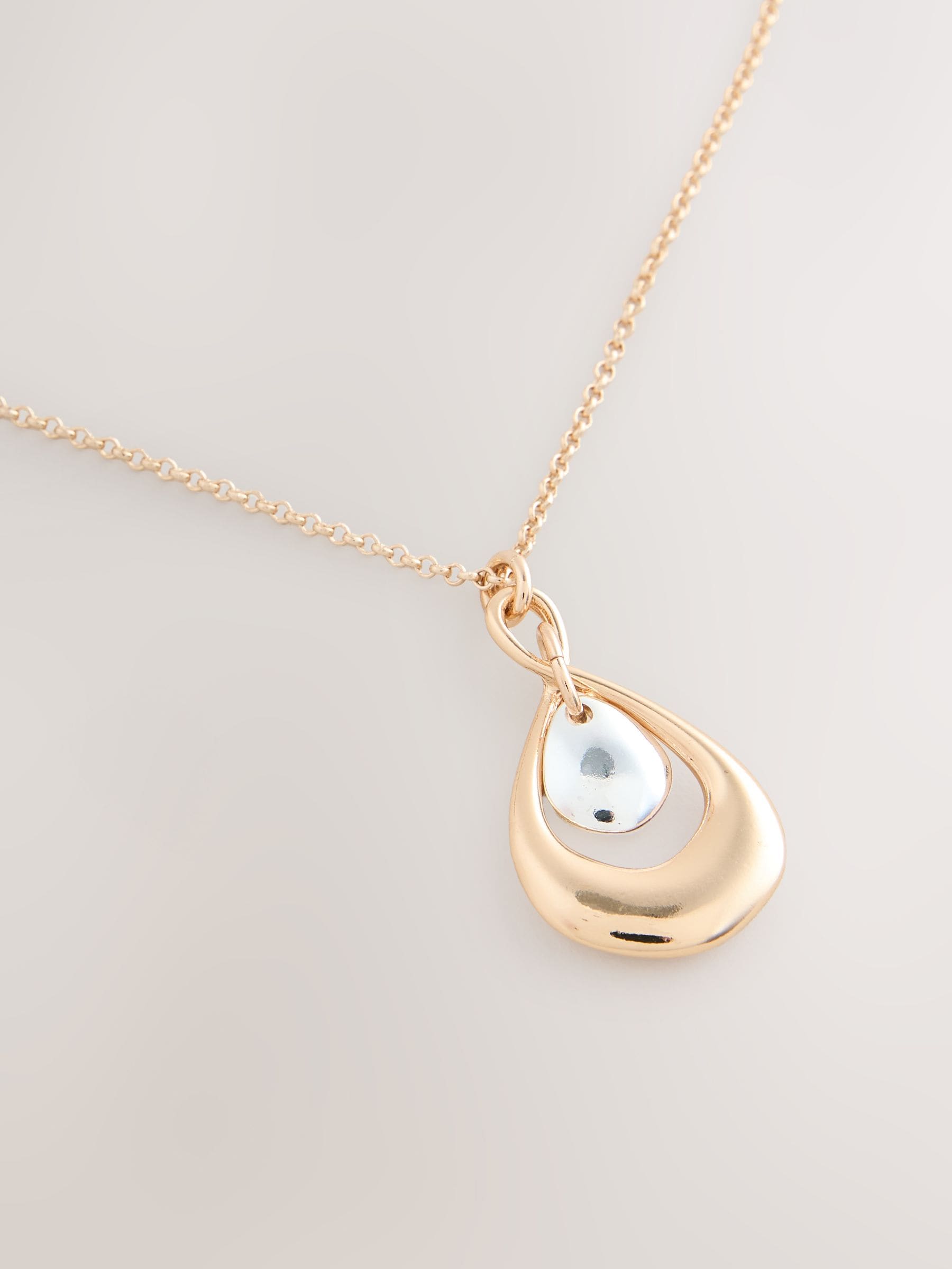 Mixed metal pendant necklace with silver and gold tones - British product