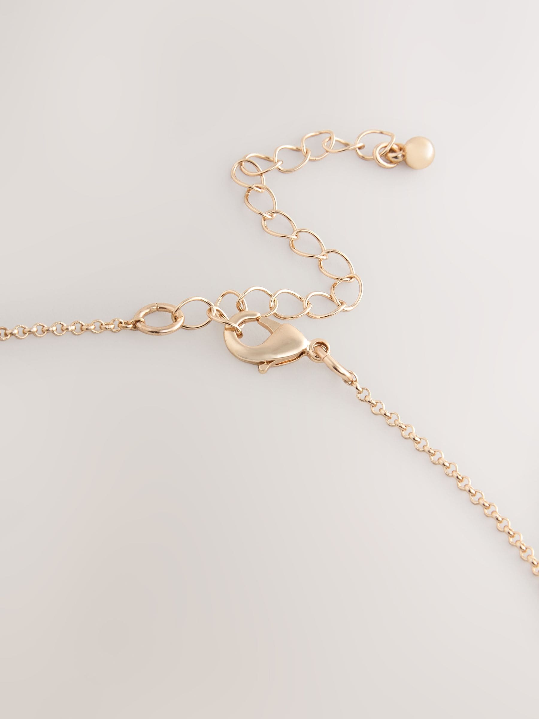 Mixed metal pendant necklace with silver and gold tones - British product