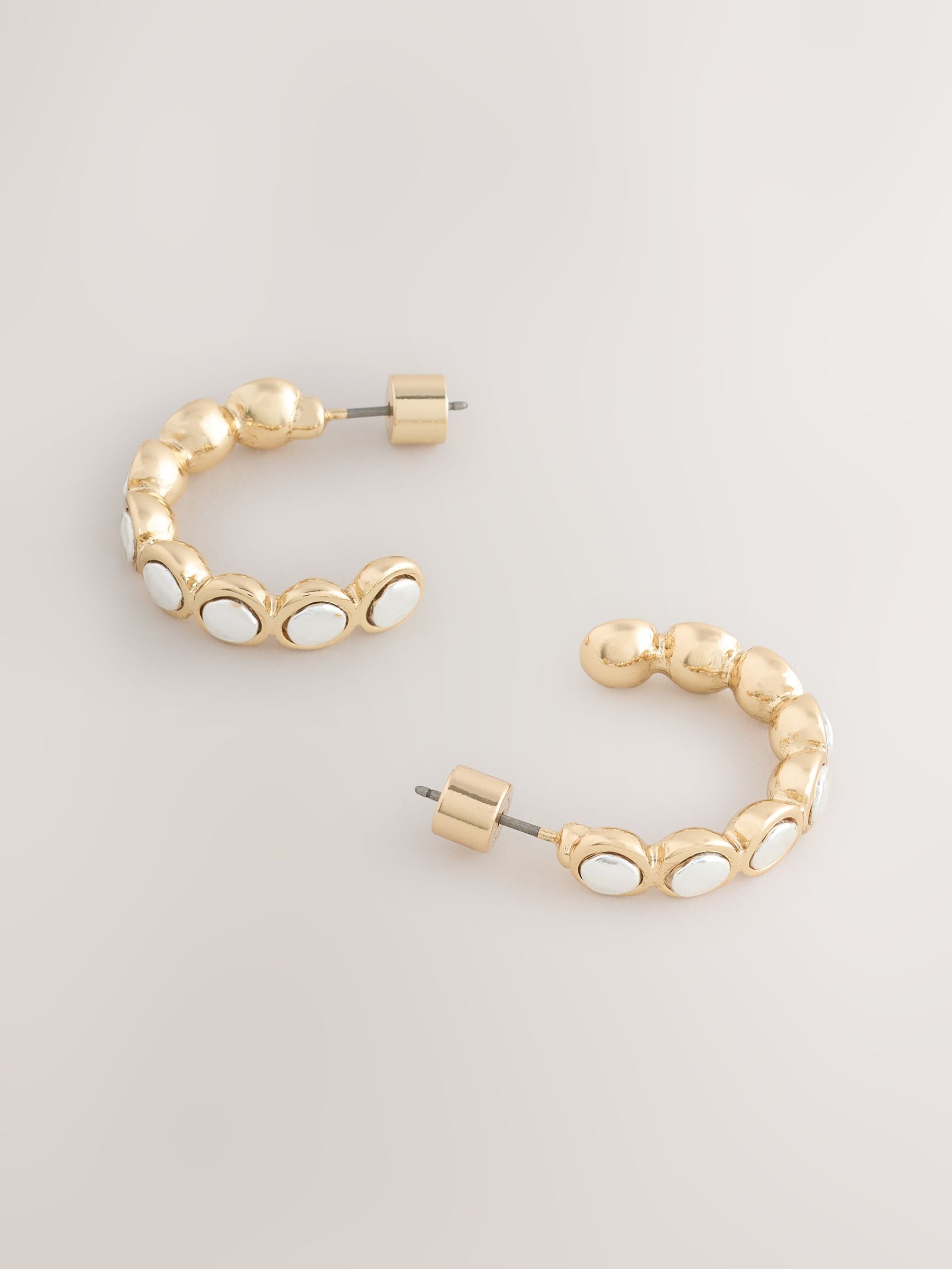 Silver tone mixed metal hoop earrings, imported from the UK
