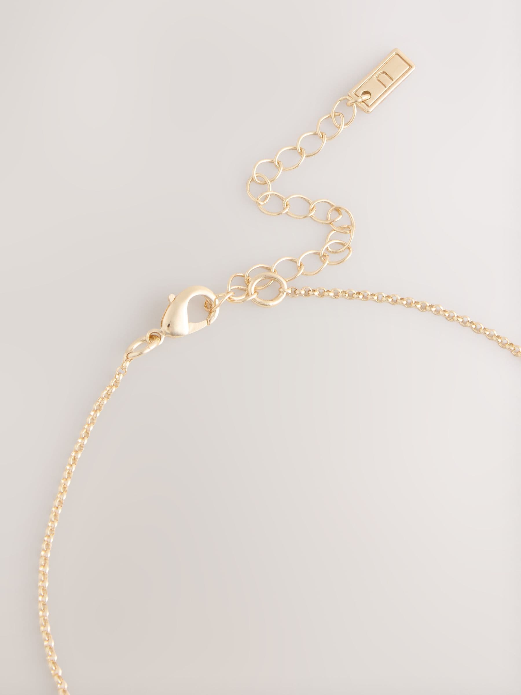 Gold tone organic pendant necklace with recycled metal, UK version