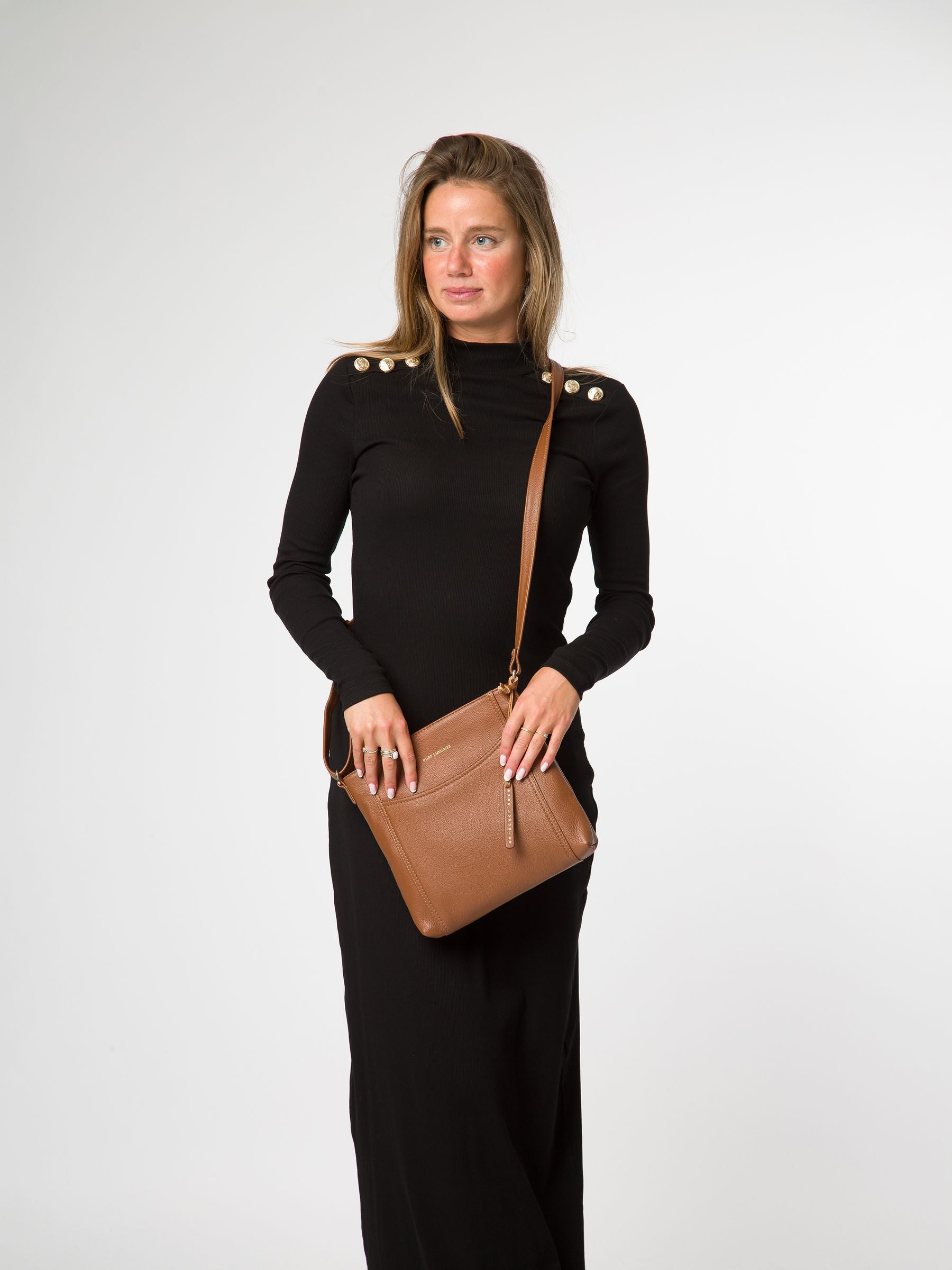 Pure Luxuries London black leather cross-body bag, imported from the UK
