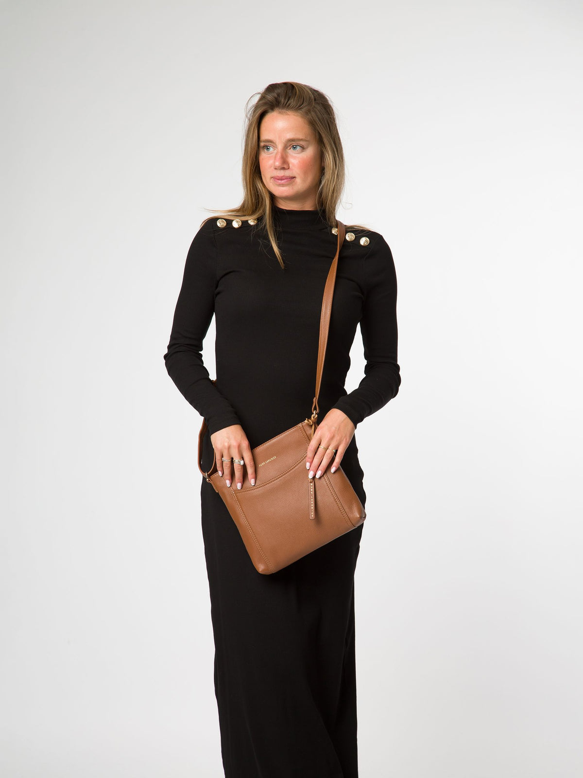 Pure Luxuries London black leather cross-body bag, imported from the UK
