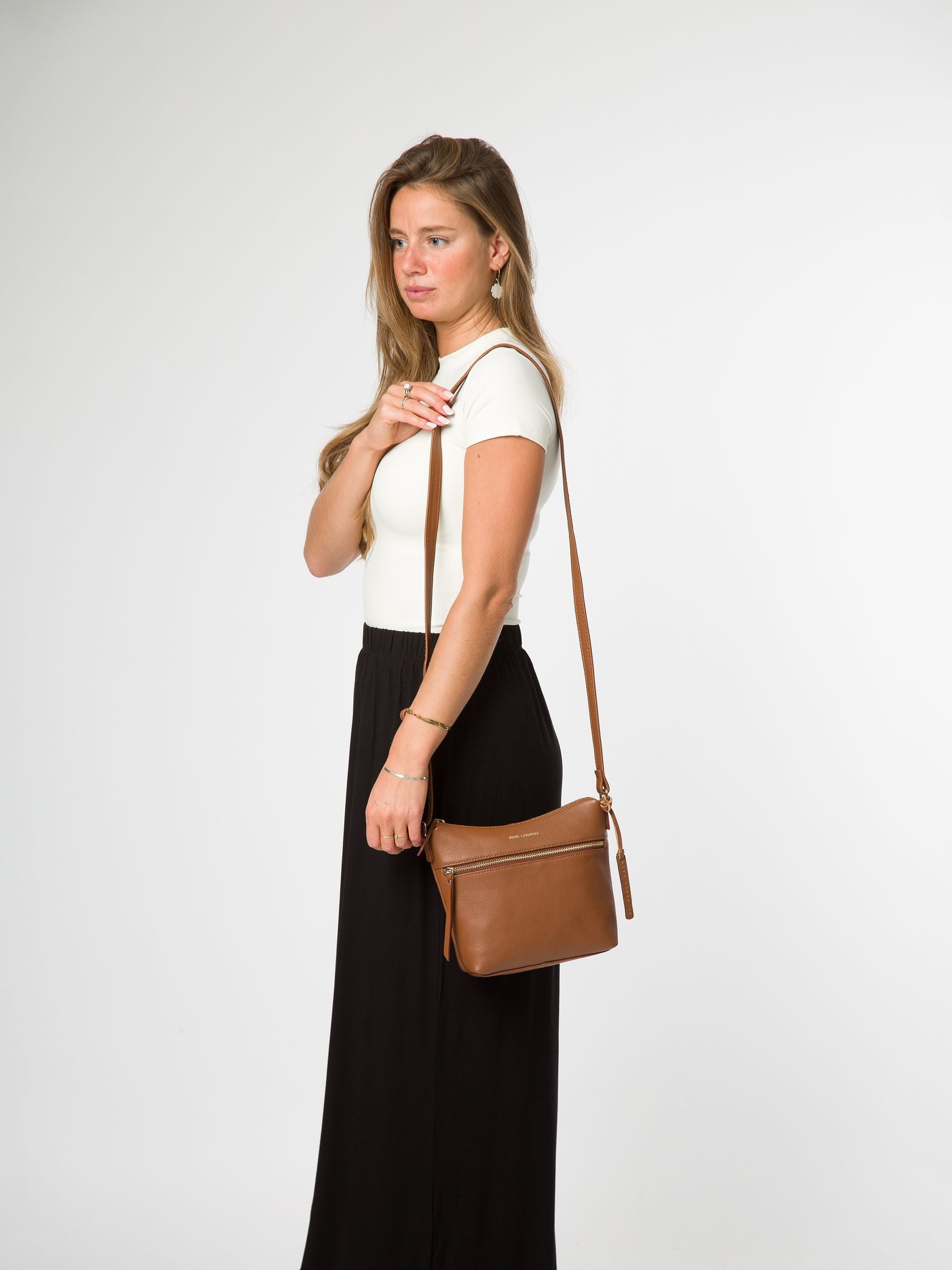 Pure Luxuries London brown Thorne leather cross-body bag, imported from the UK