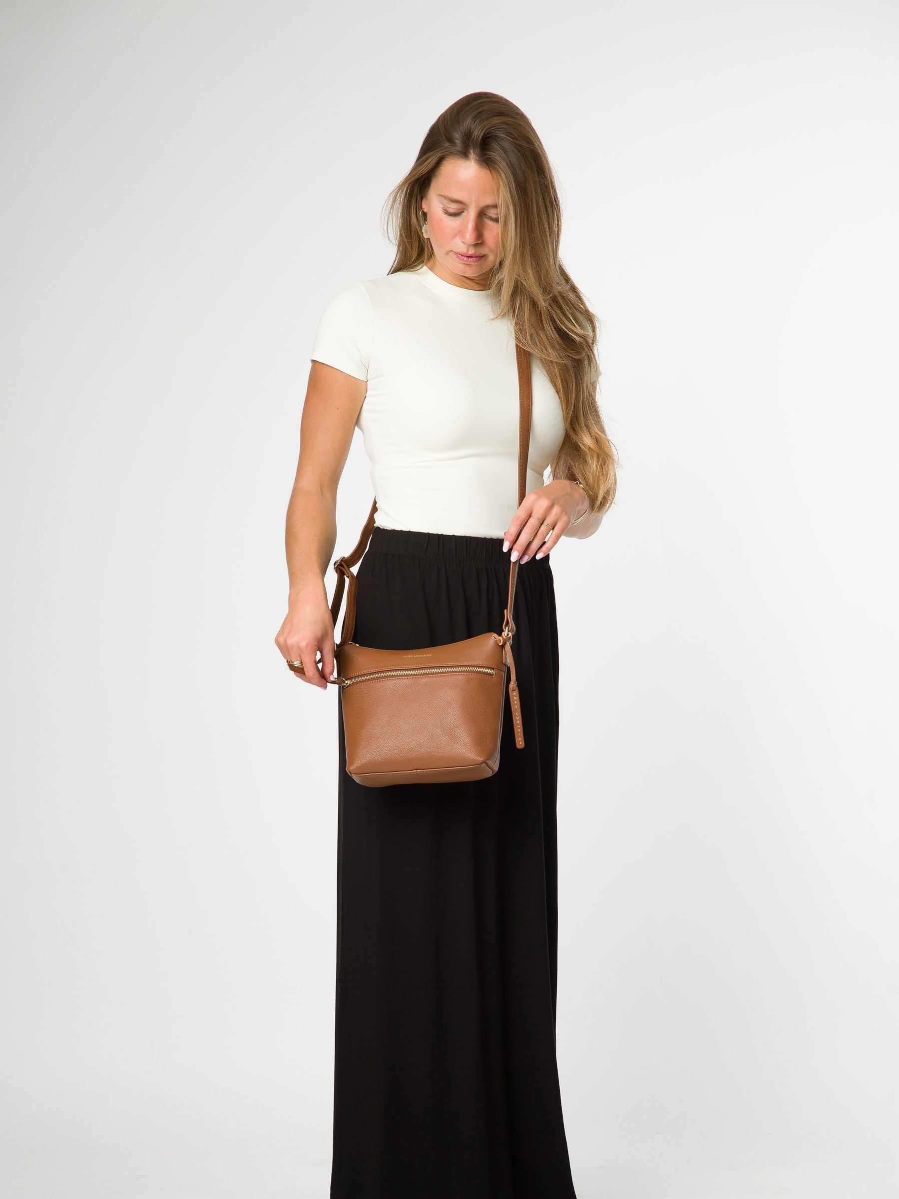 Pure Luxuries London brown Thorne leather cross-body bag, imported from the UK