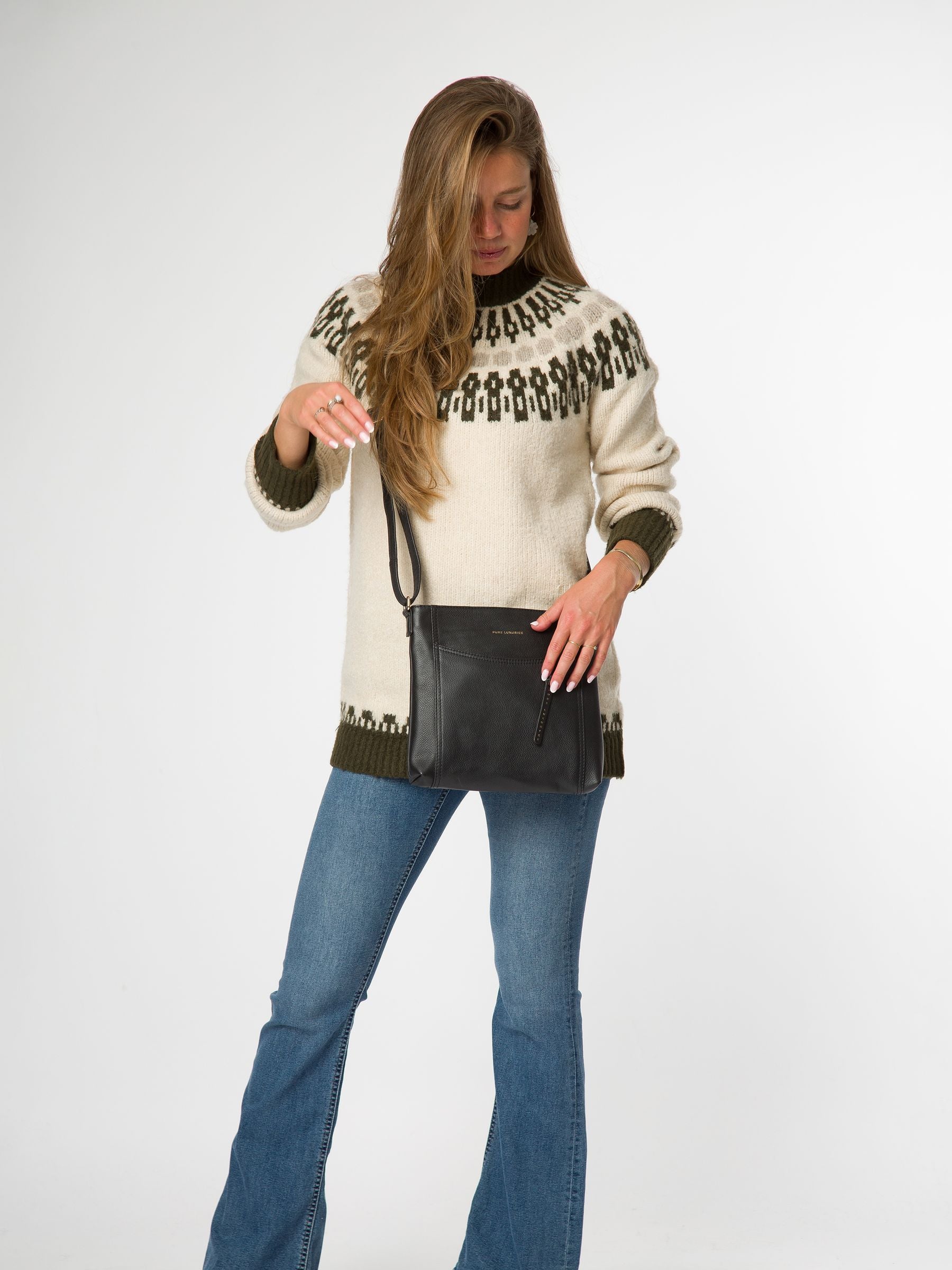 Pure Luxuries London black leather cross-body bag, imported from the UK