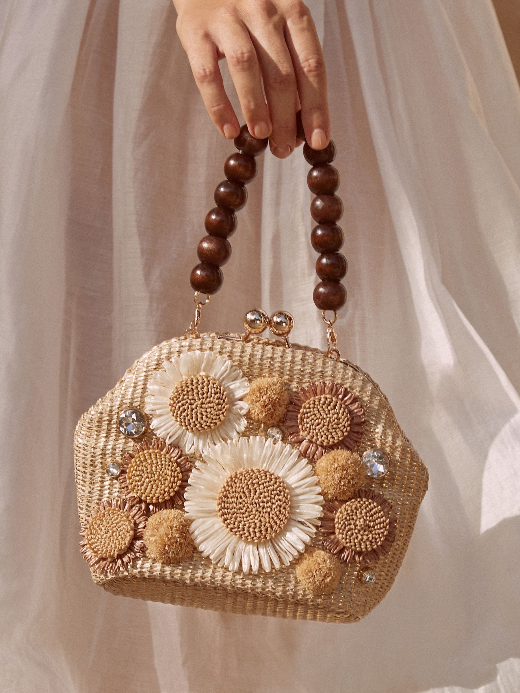 Natural raffia top handle clutch bag with 3D flower, imported from the UK