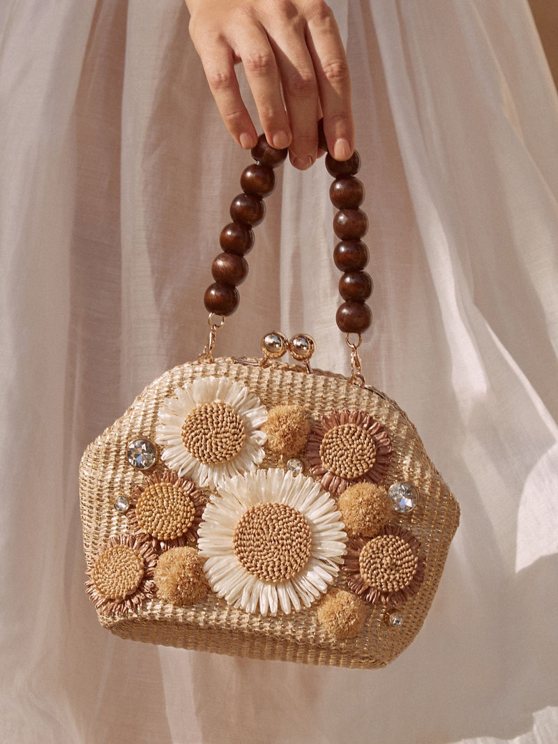 Natural raffia top handle clutch bag with 3D flower, imported from the UK