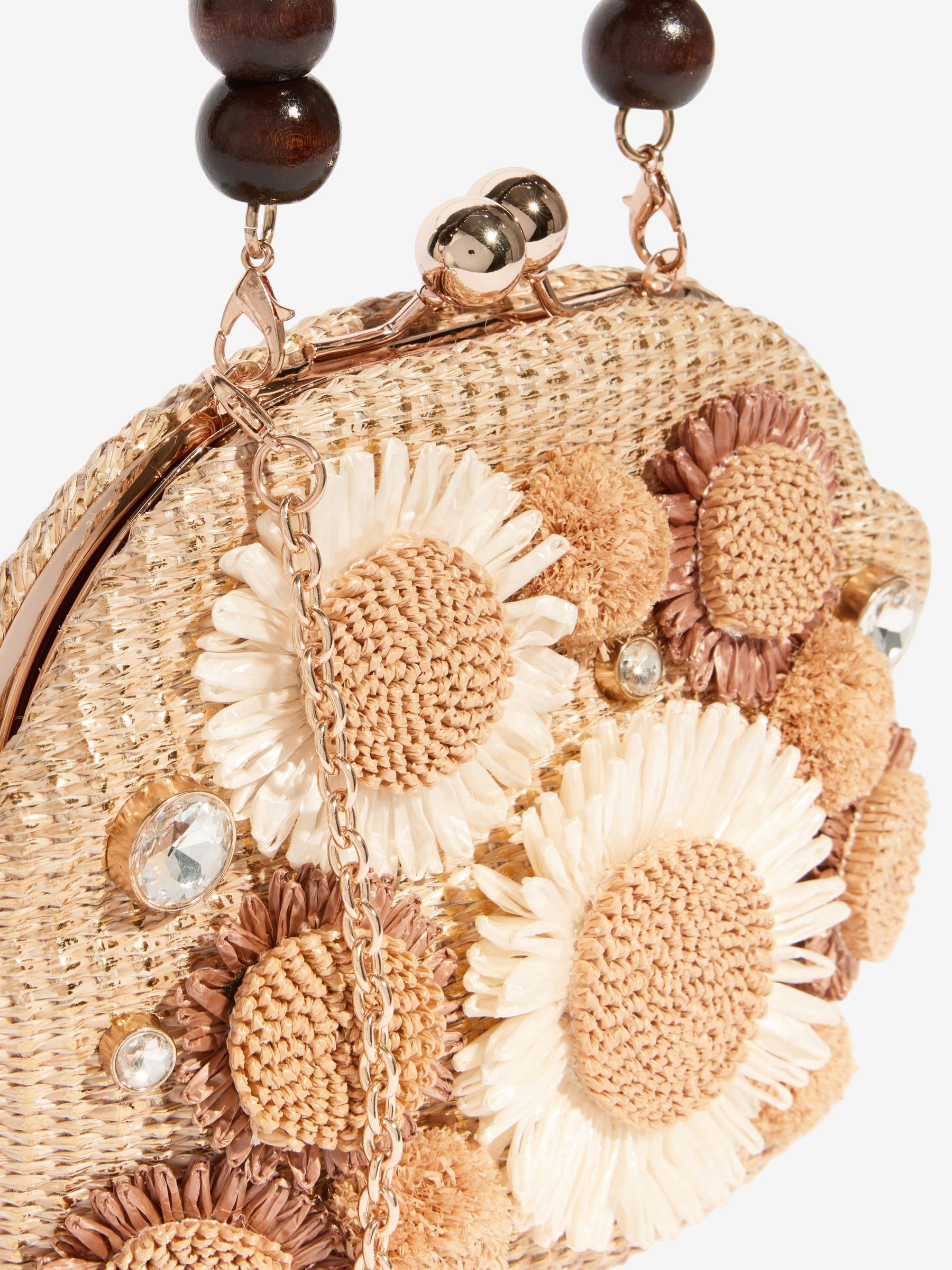 Natural raffia top handle clutch bag with 3D flower, imported from the UK