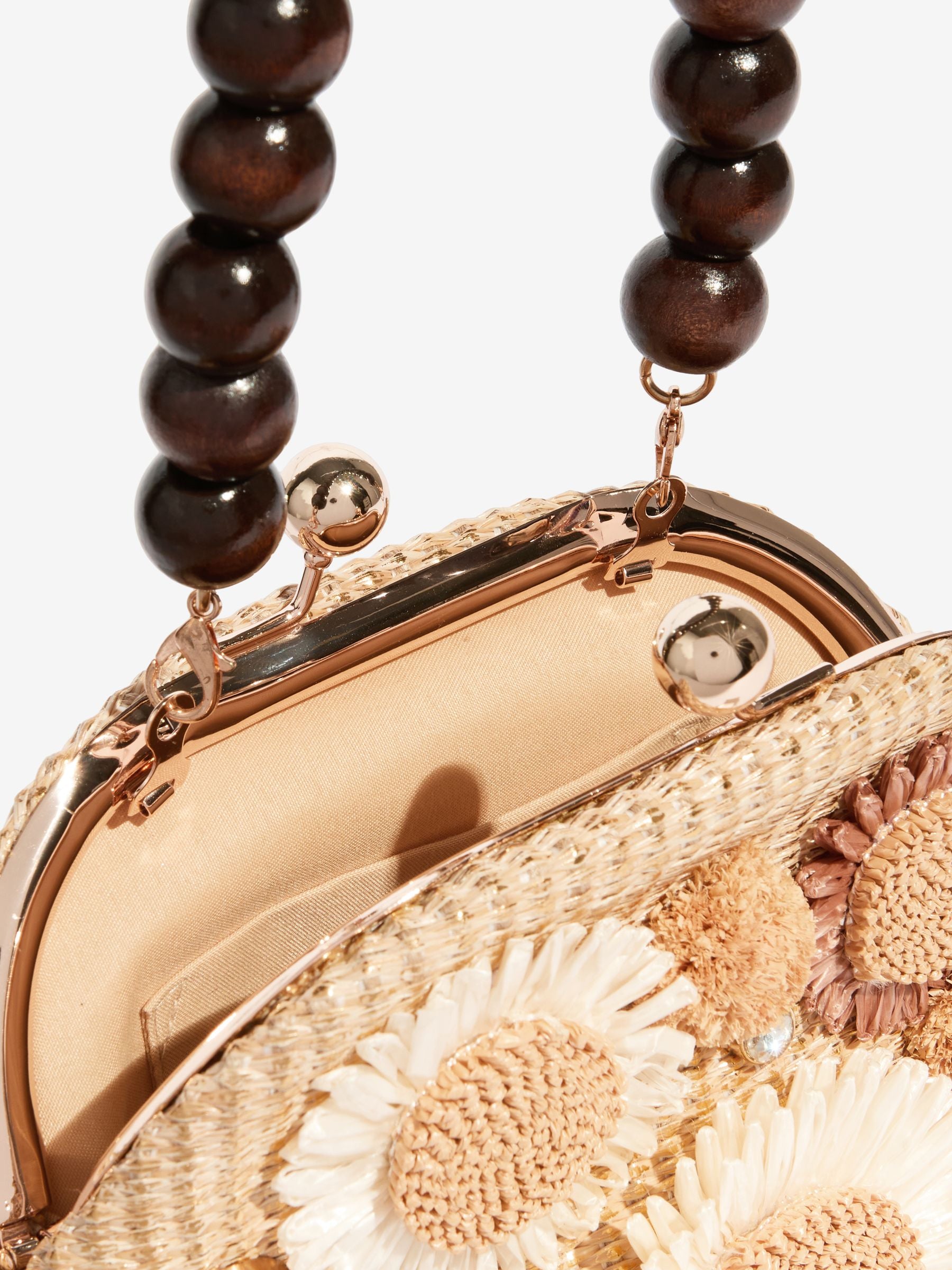 Natural raffia top handle clutch bag with 3D flower, imported from the UK
