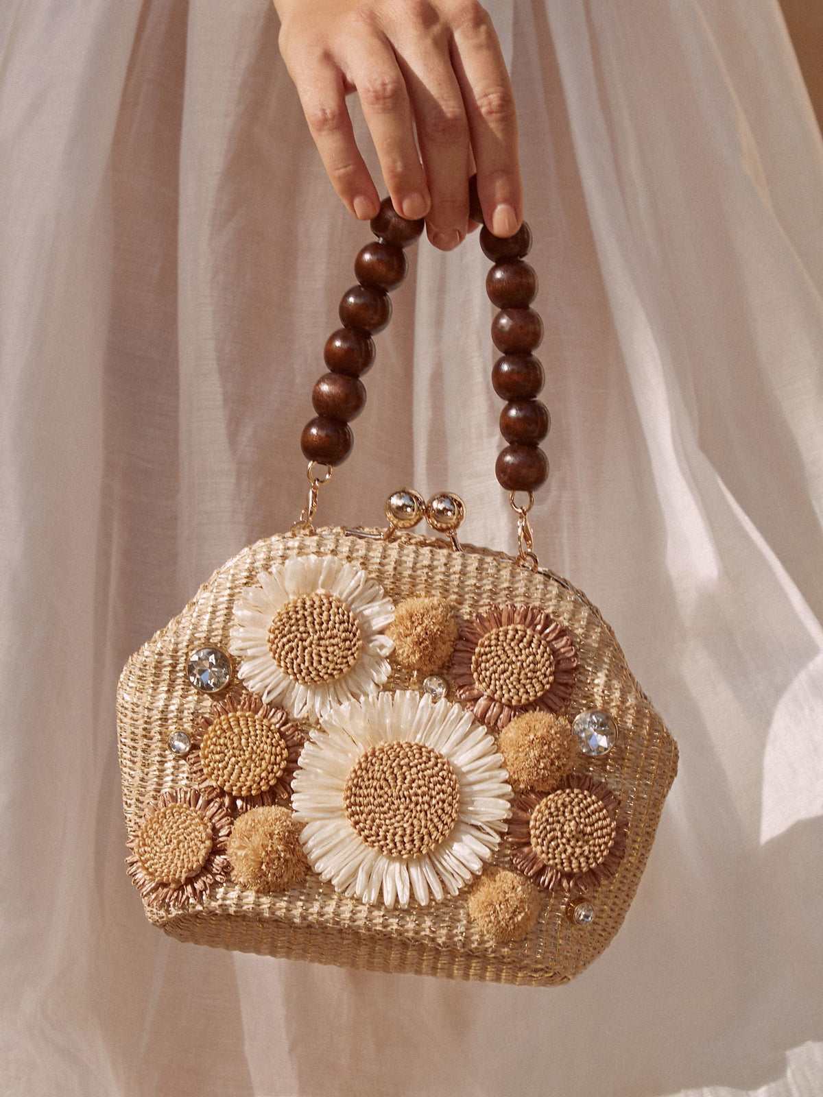 Natural raffia top handle clutch bag with 3D flower, imported from the UK