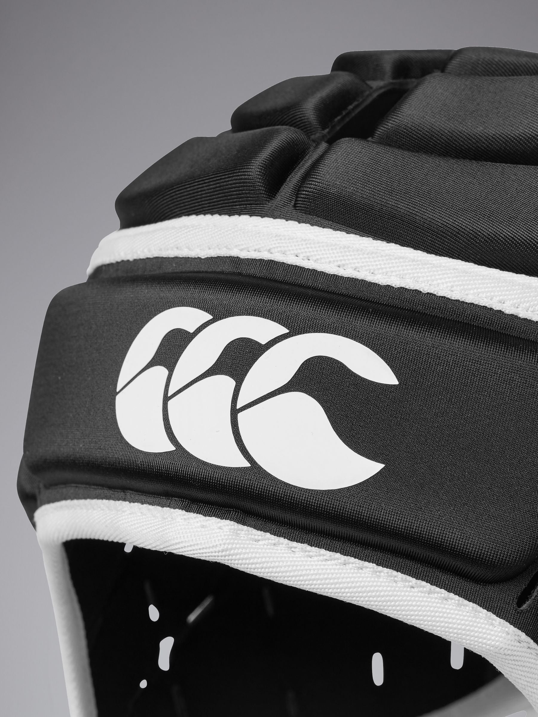 Canterbury Core headguard in black with EVA foam protection, UK version
