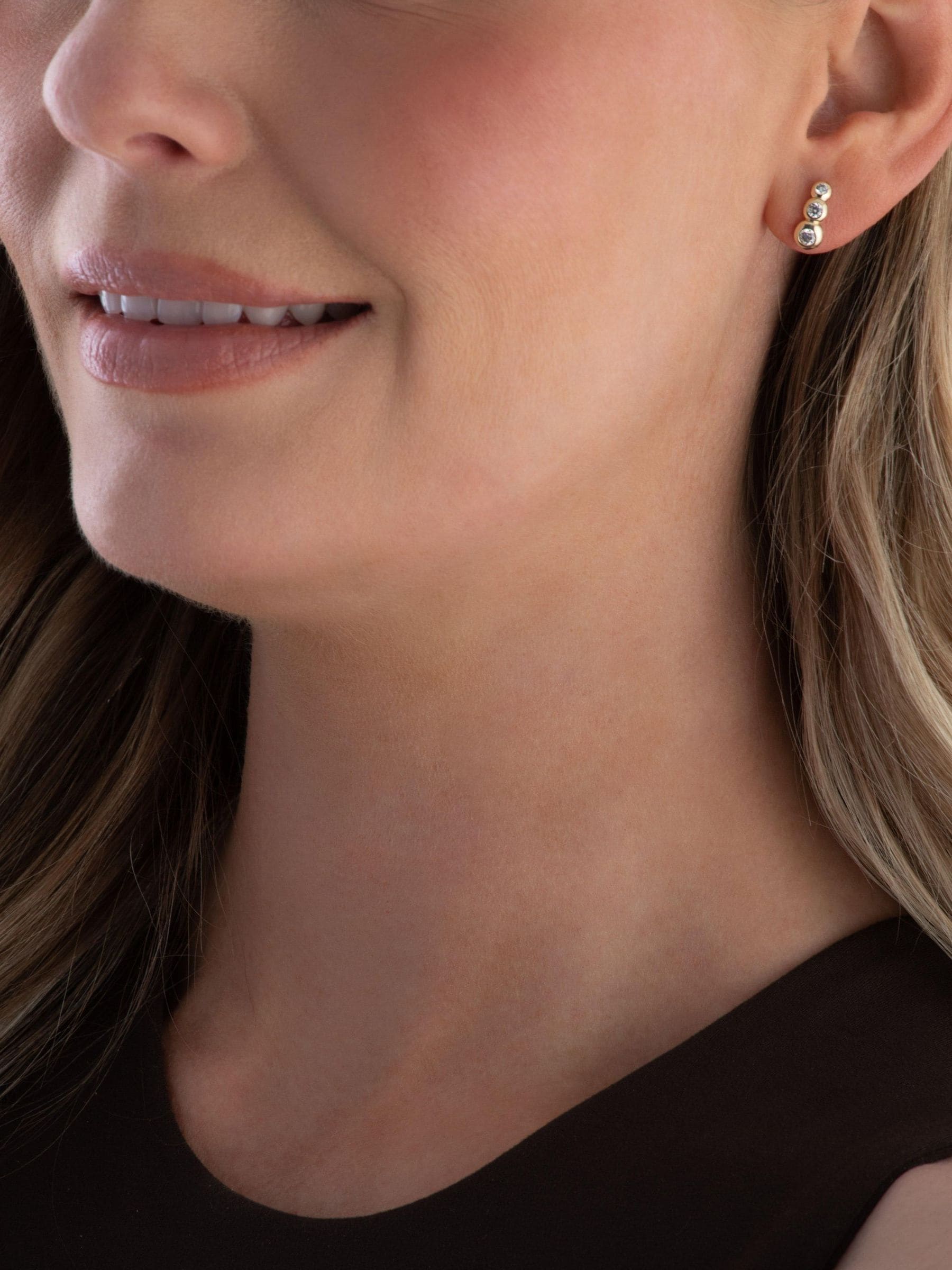 Beaverbrooks gold stud earrings cubic zirconia swirl, imported from the UK