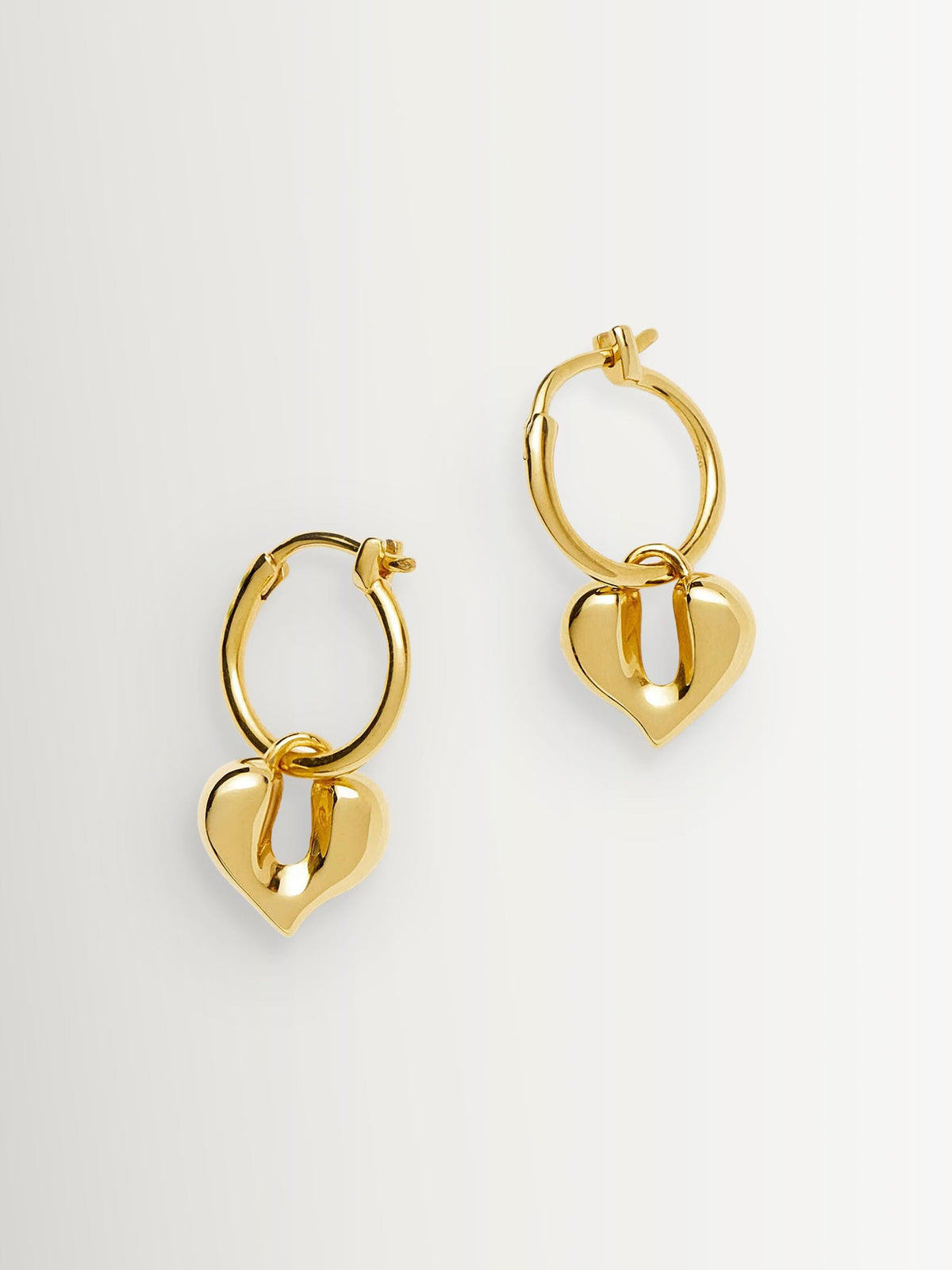Missoma gold tone molten heart charm hoop earrings - British product