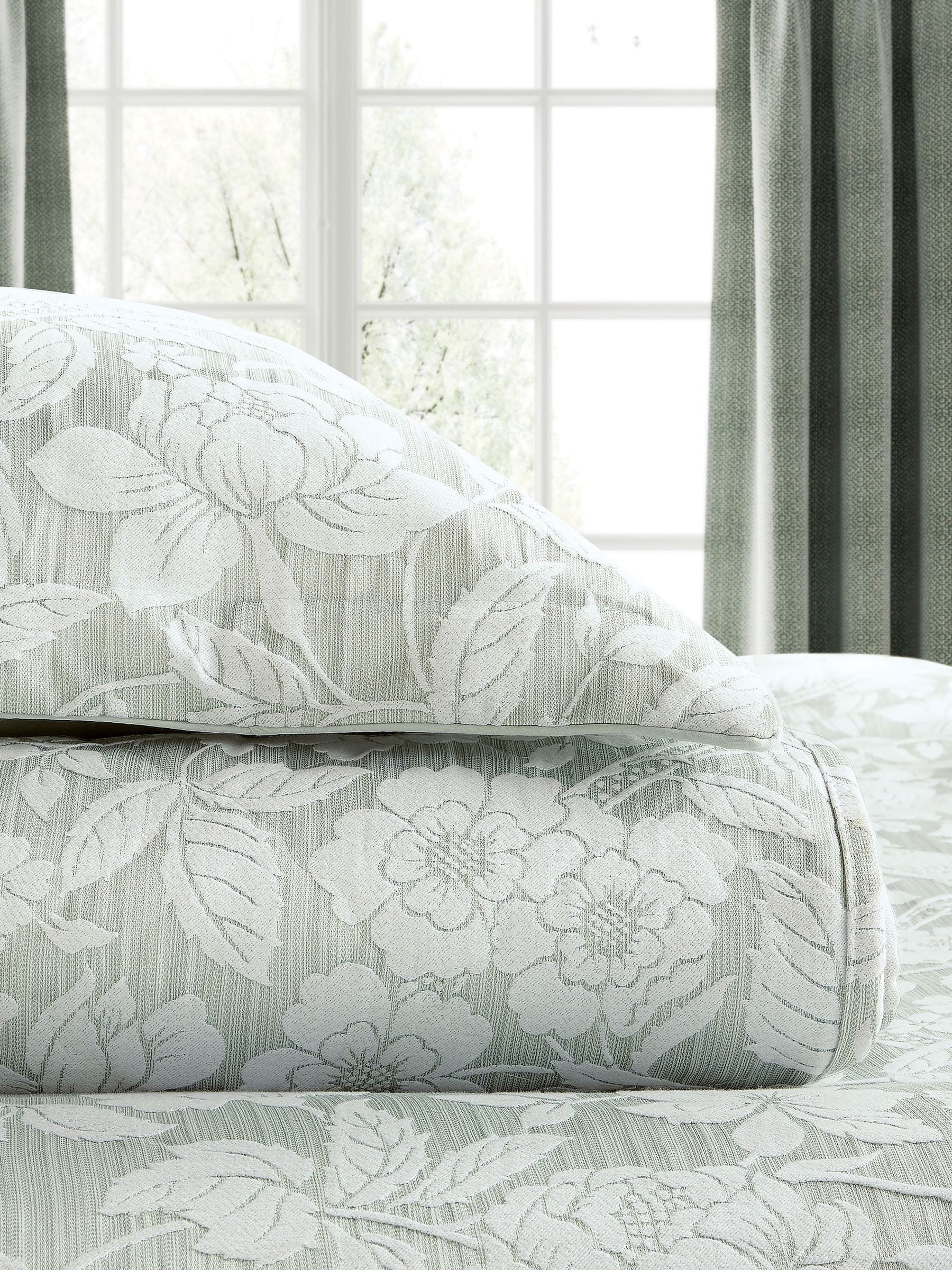 Sanderson Aqua Pyramus quilted throw in jacquard, imported from the UK
