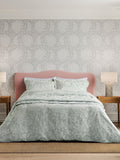 Sanderson Aqua Pyramus quilted throw in jacquard, imported from the UK