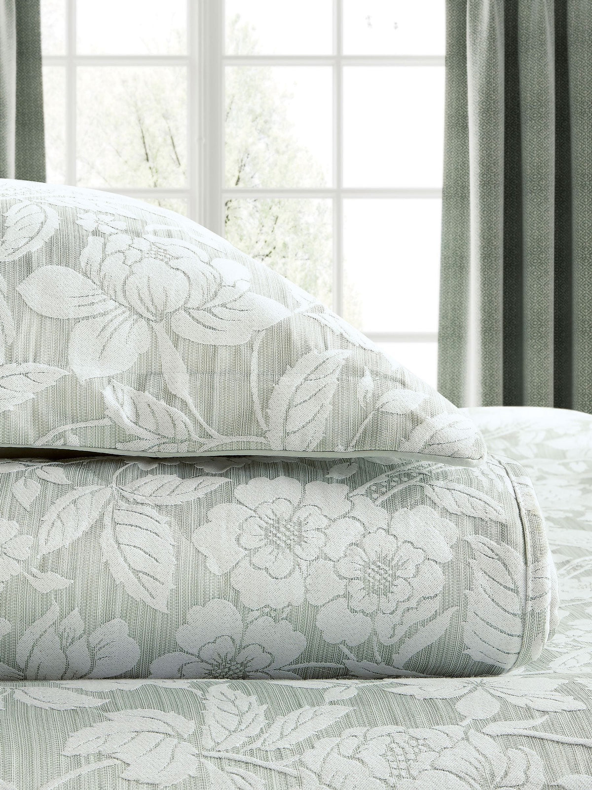 Sanderson Aqua Pyramus quilted throw in jacquard, imported from the UK
