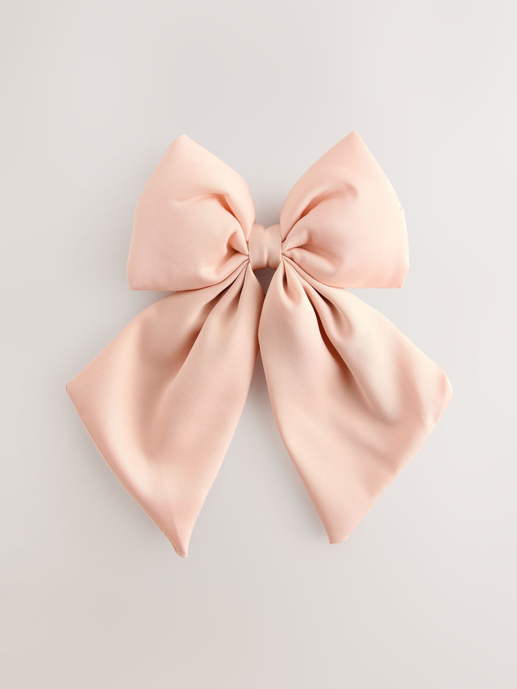 Pink statement bow hair clip, UK version