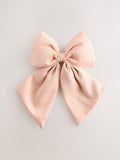 Pink statement bow hair clip, UK version