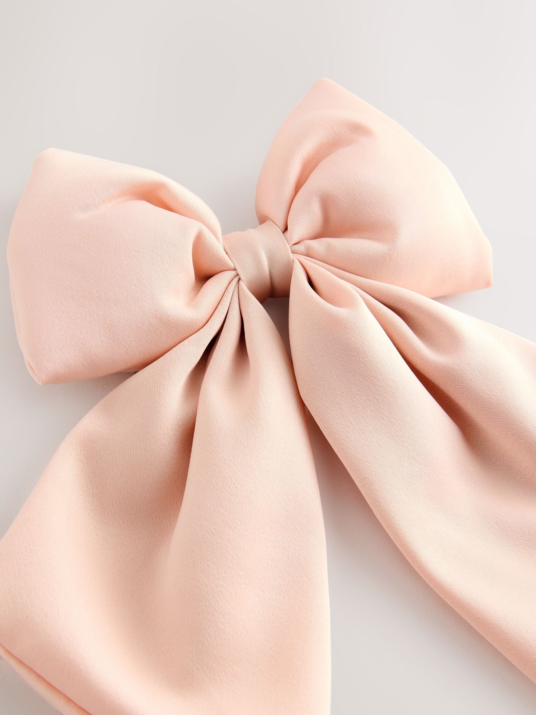 Pink statement bow hair clip, UK version