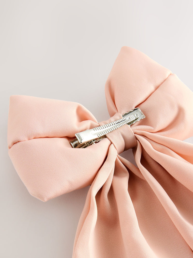 Pink statement bow hair clip, UK version