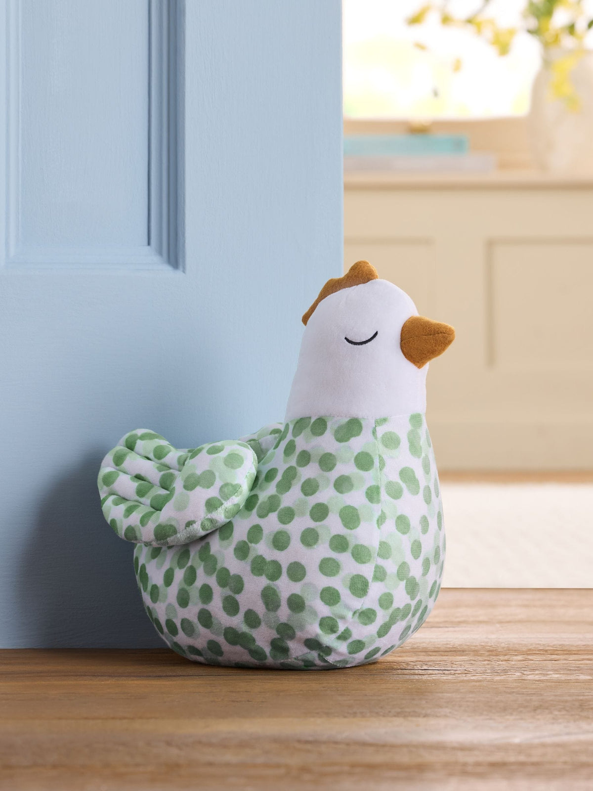 Sage green polka dot chicken doorstop, imported from the UK