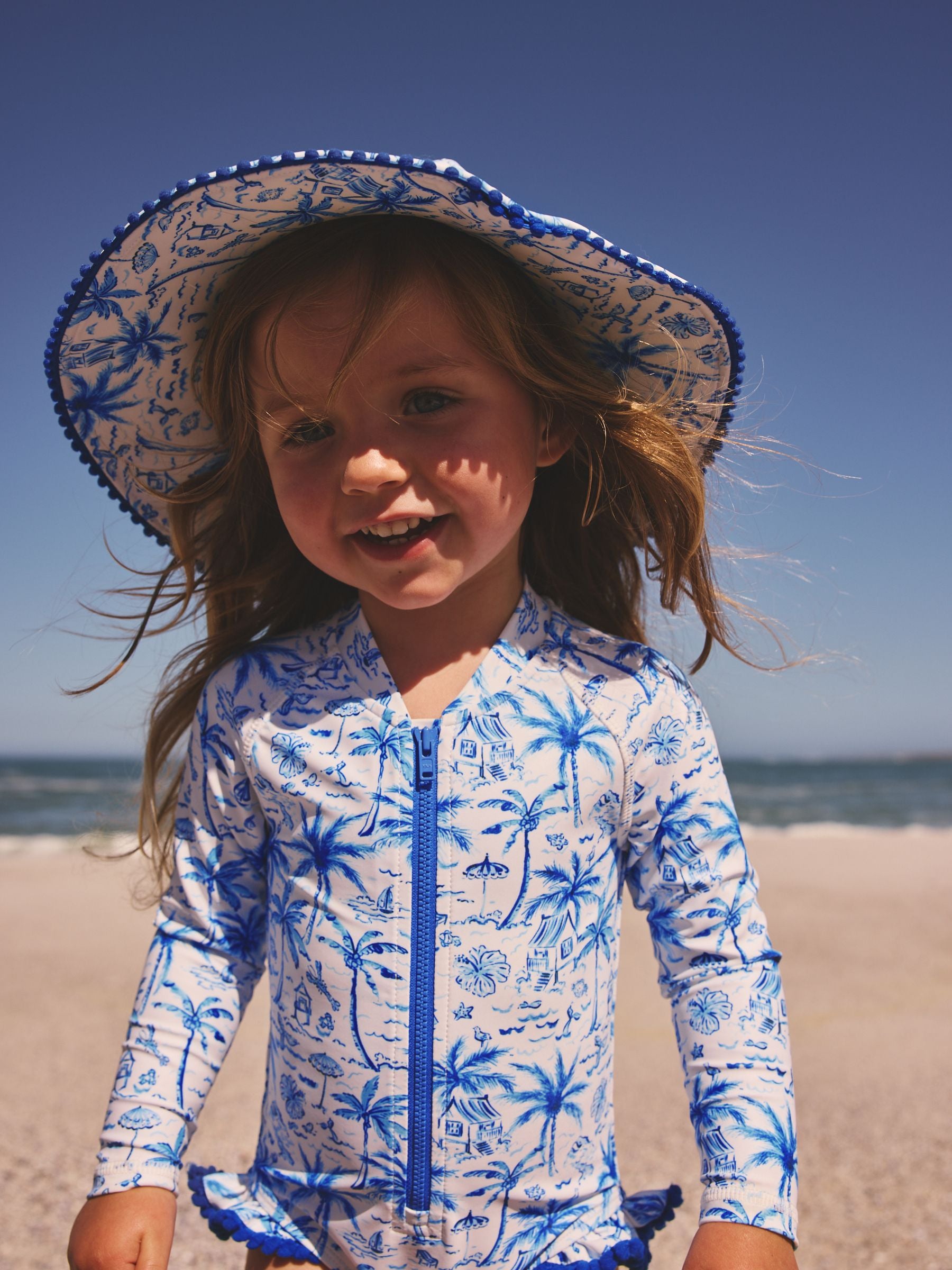 Blue palm print swim hat UPF 50+ for children - British product