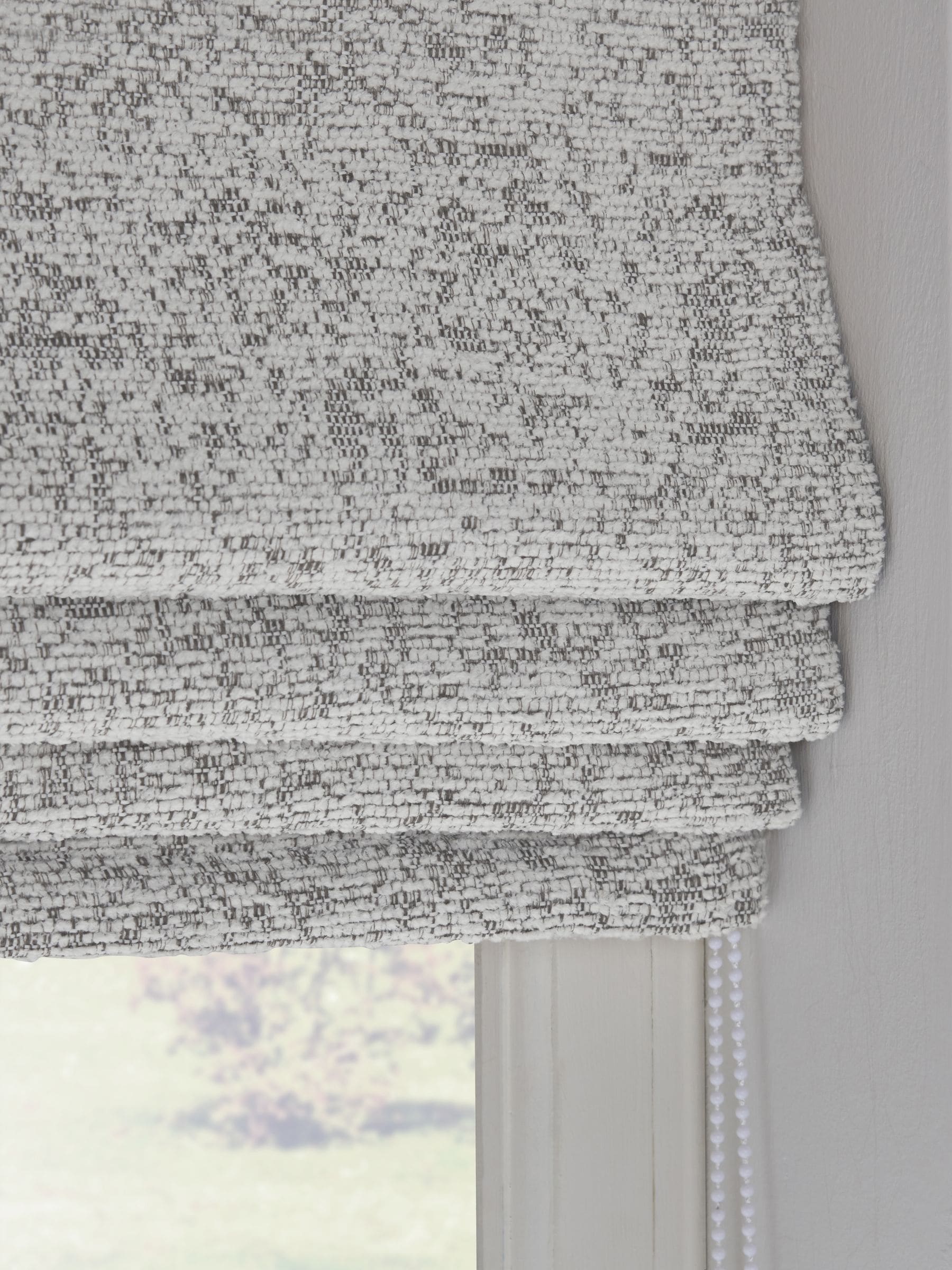 Light grey bouclé roman blind with blackout thermal lining (British brand)