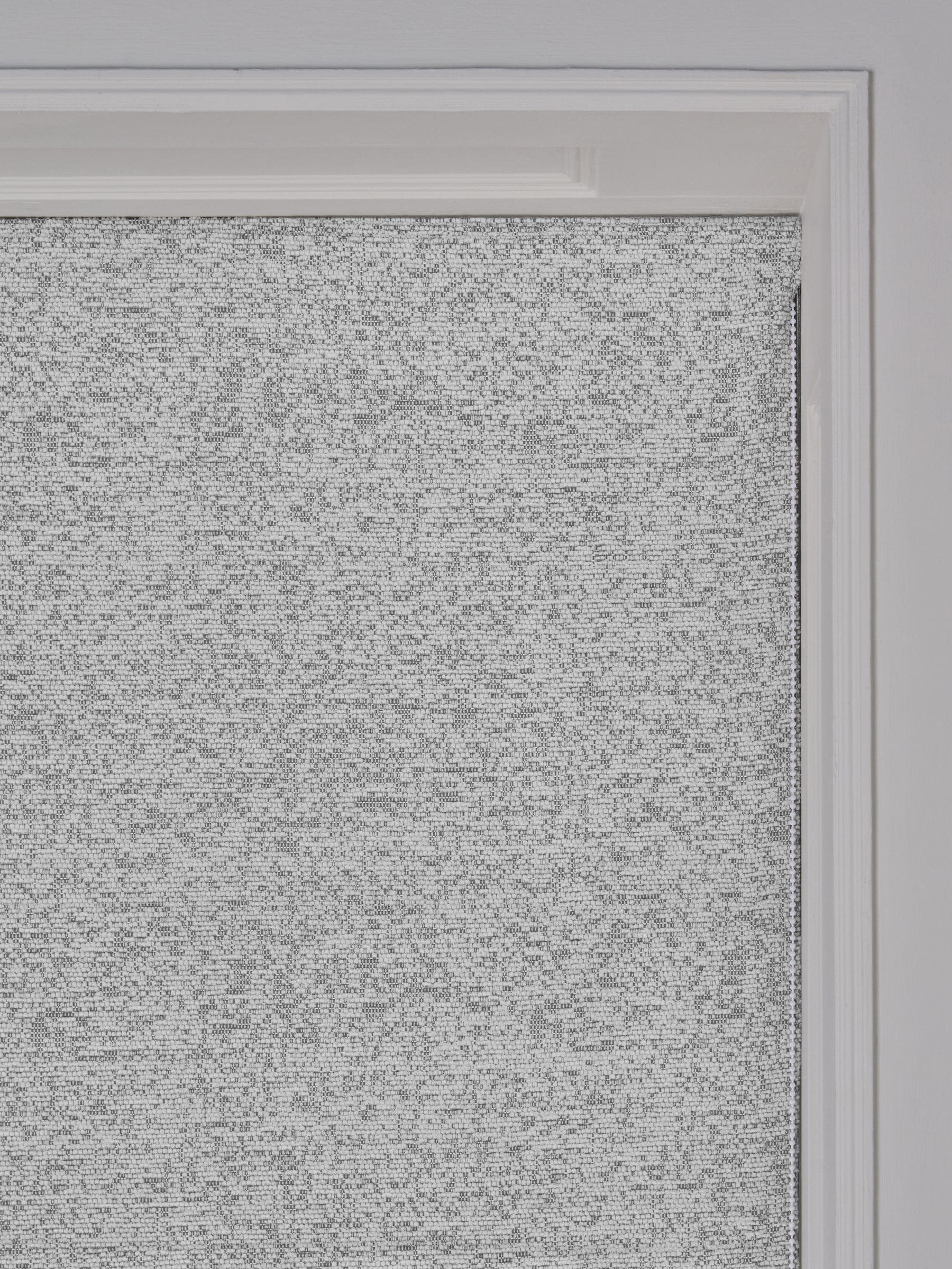 Light grey bouclé roman blind with blackout thermal lining (British brand)