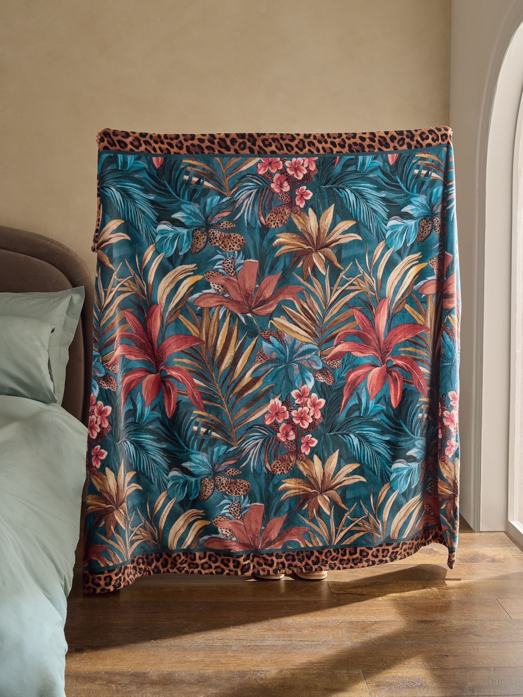 Tropical print fleece throw teal blue (British brand)