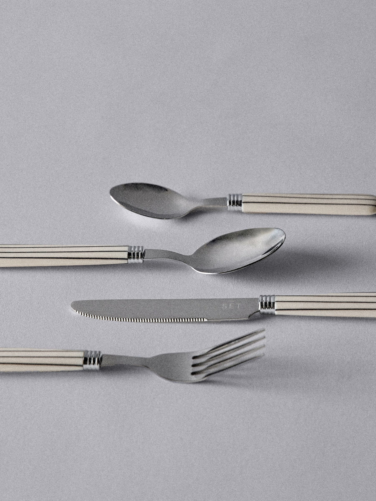 The Set Natural Striped 24 piece cutlery set, imported from the UK