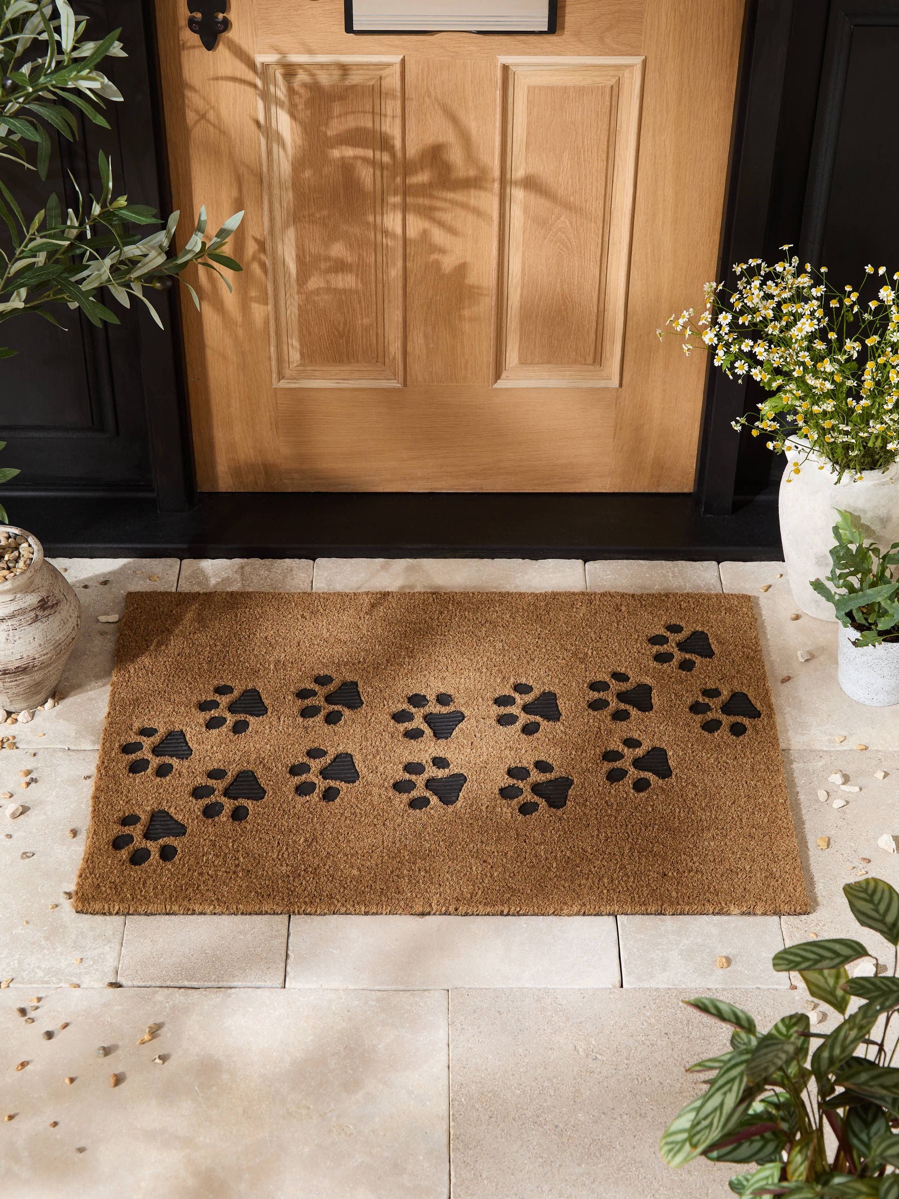 Natural embossed paw print coir doormat - British product