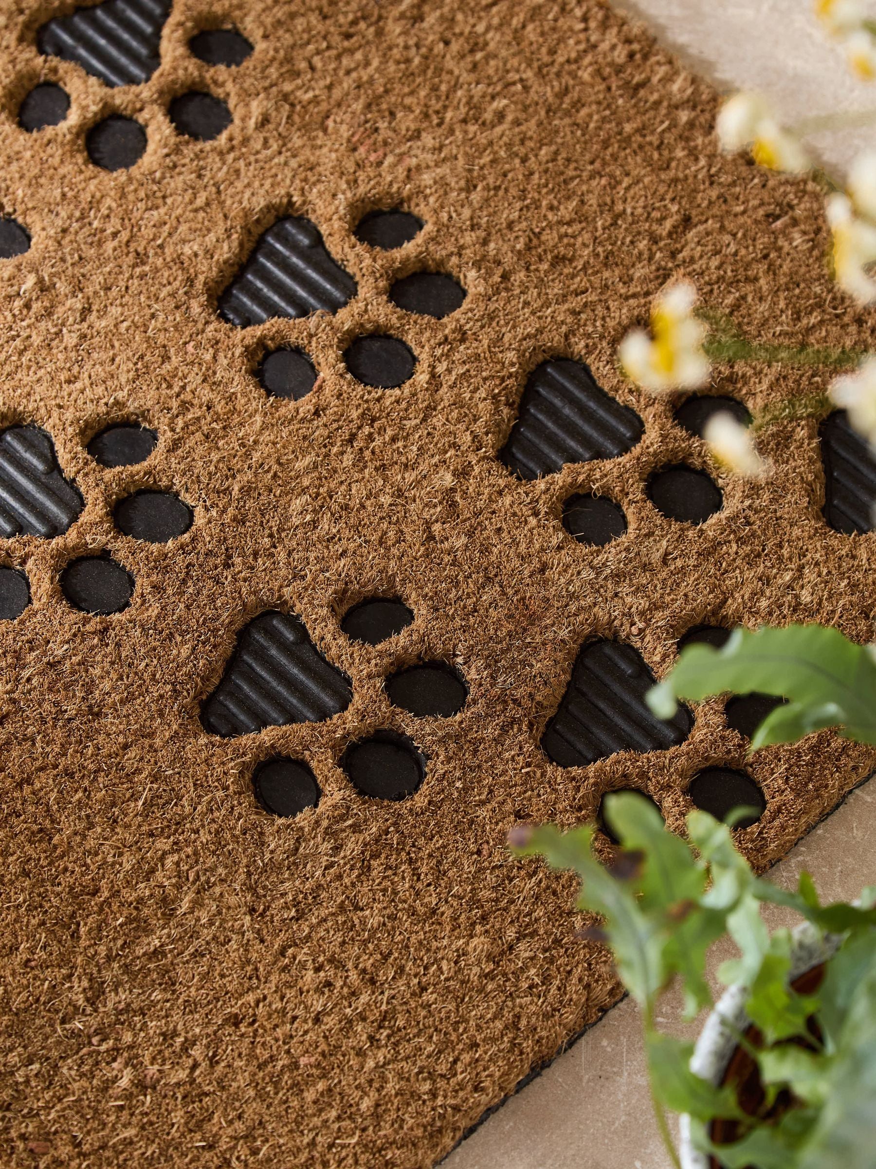 Natural embossed paw print coir doormat - British product
