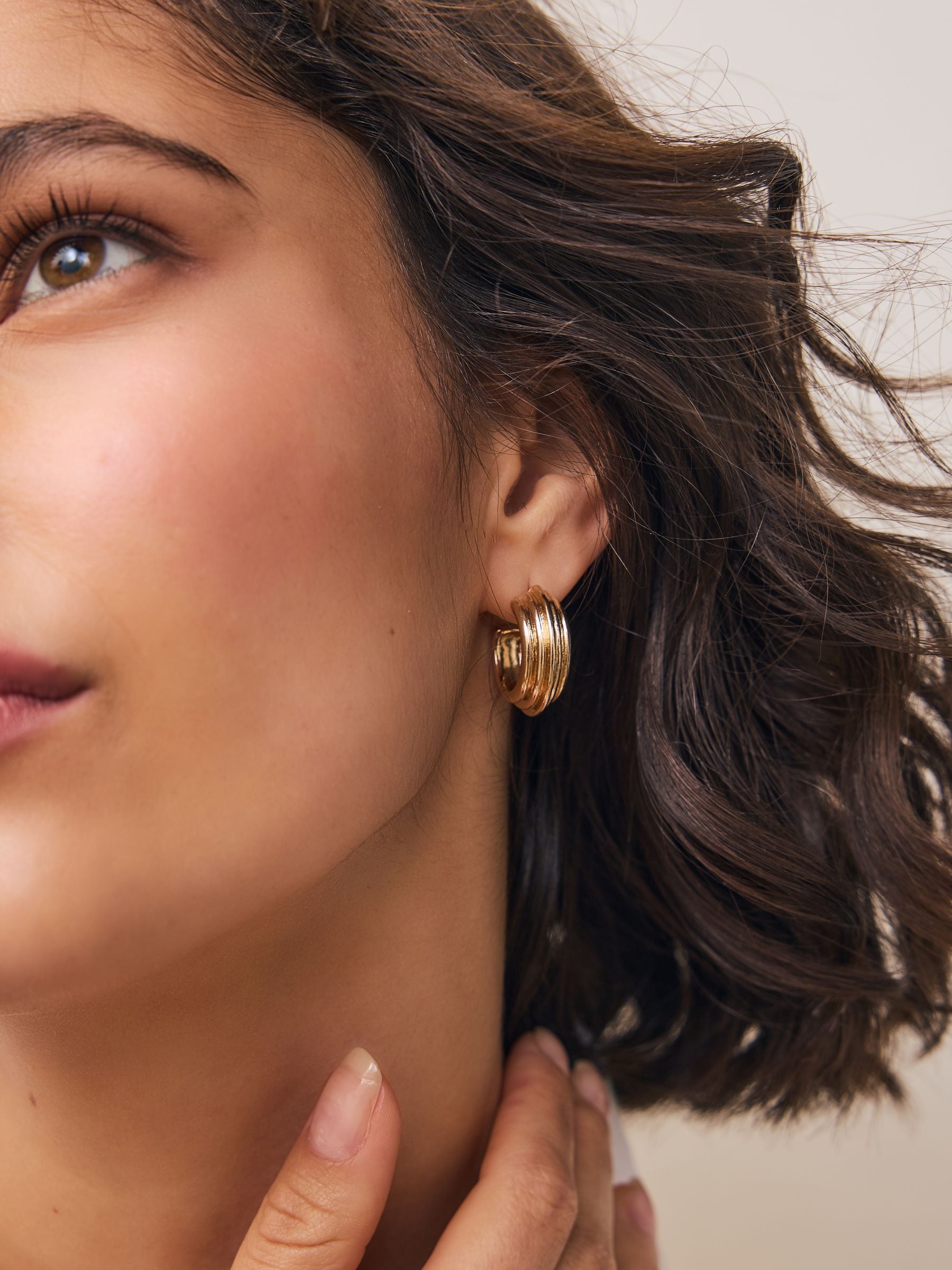 Gold tone hoop earrings, imported from the UK