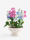Multi bright artificial florals in ceramic bowl, imported from the UK