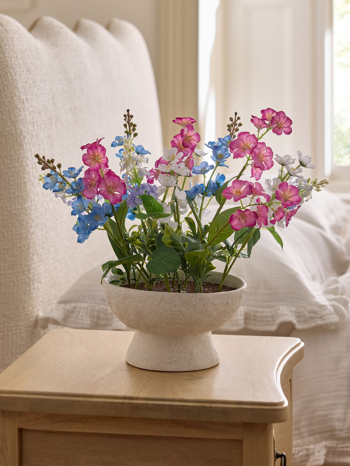 Multi bright artificial florals in ceramic bowl, imported from the UK