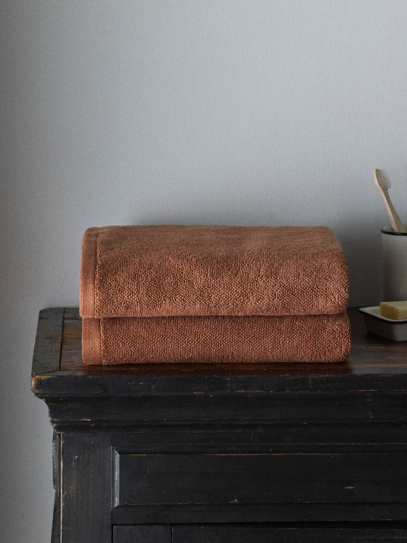 The Set rust popcorn textured 100% cotton bath towels, imported from the UK
