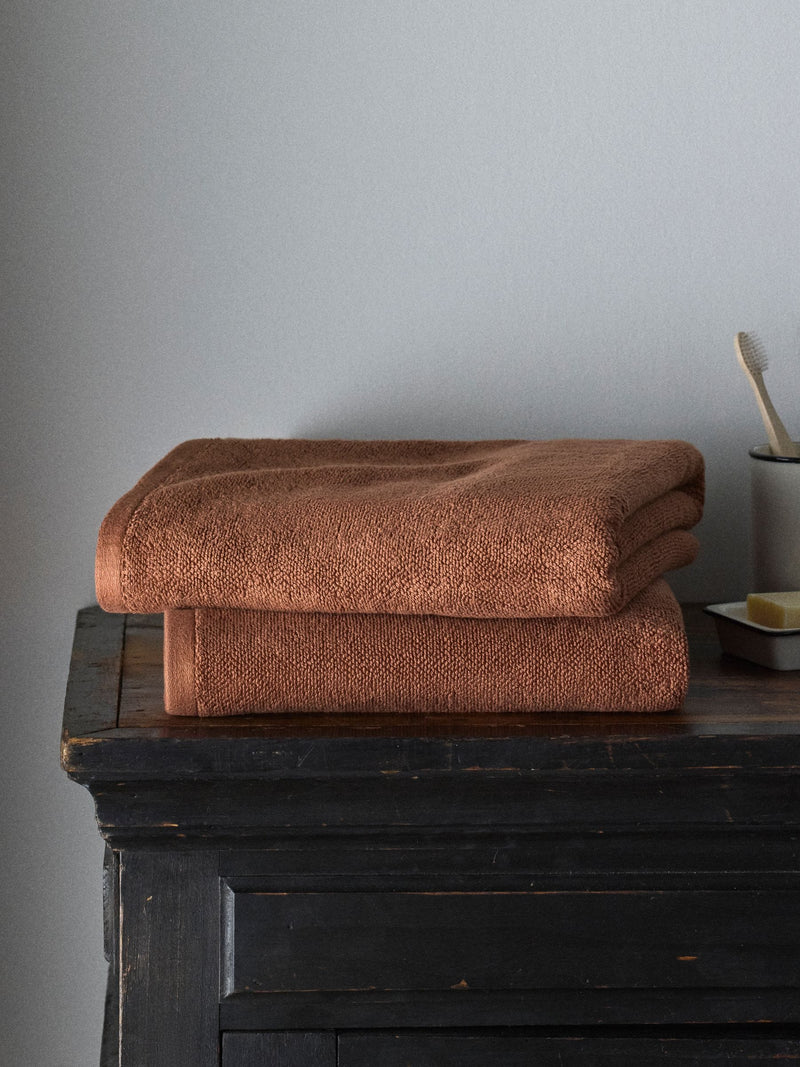 The Set rust popcorn textured 100% cotton bath towels, imported from the UK