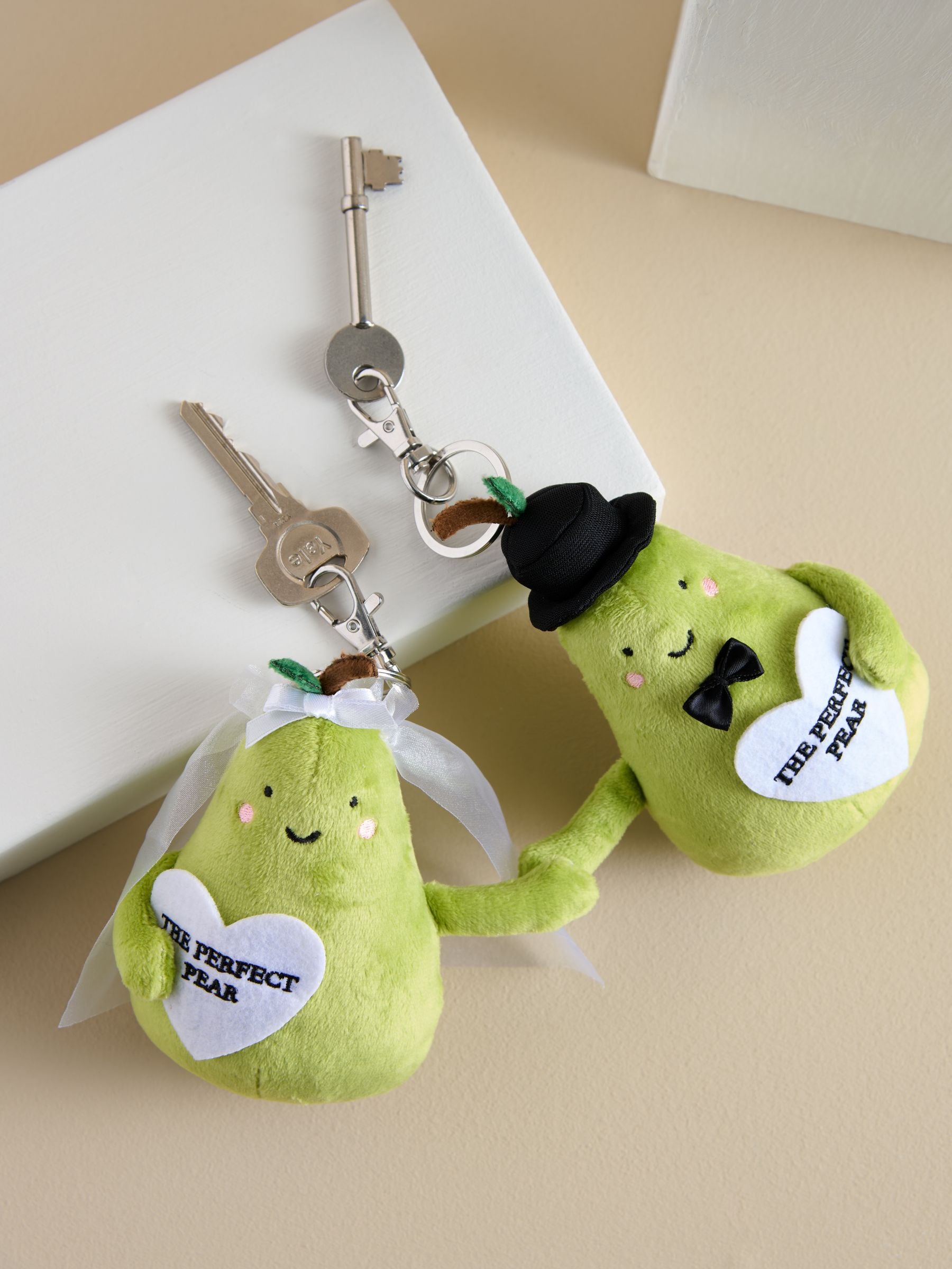 Green plush pear bag charm for weddings, imported from the UK
