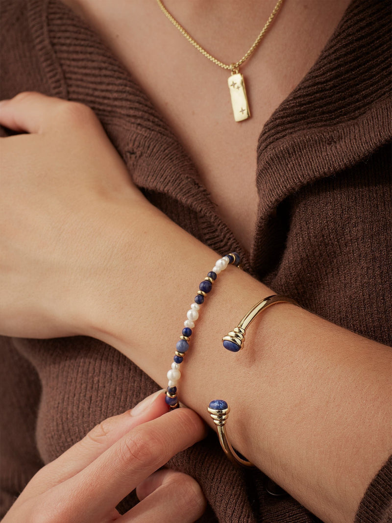 Estella Bartlett gold tone - navy tone cabochon open bangle - British product