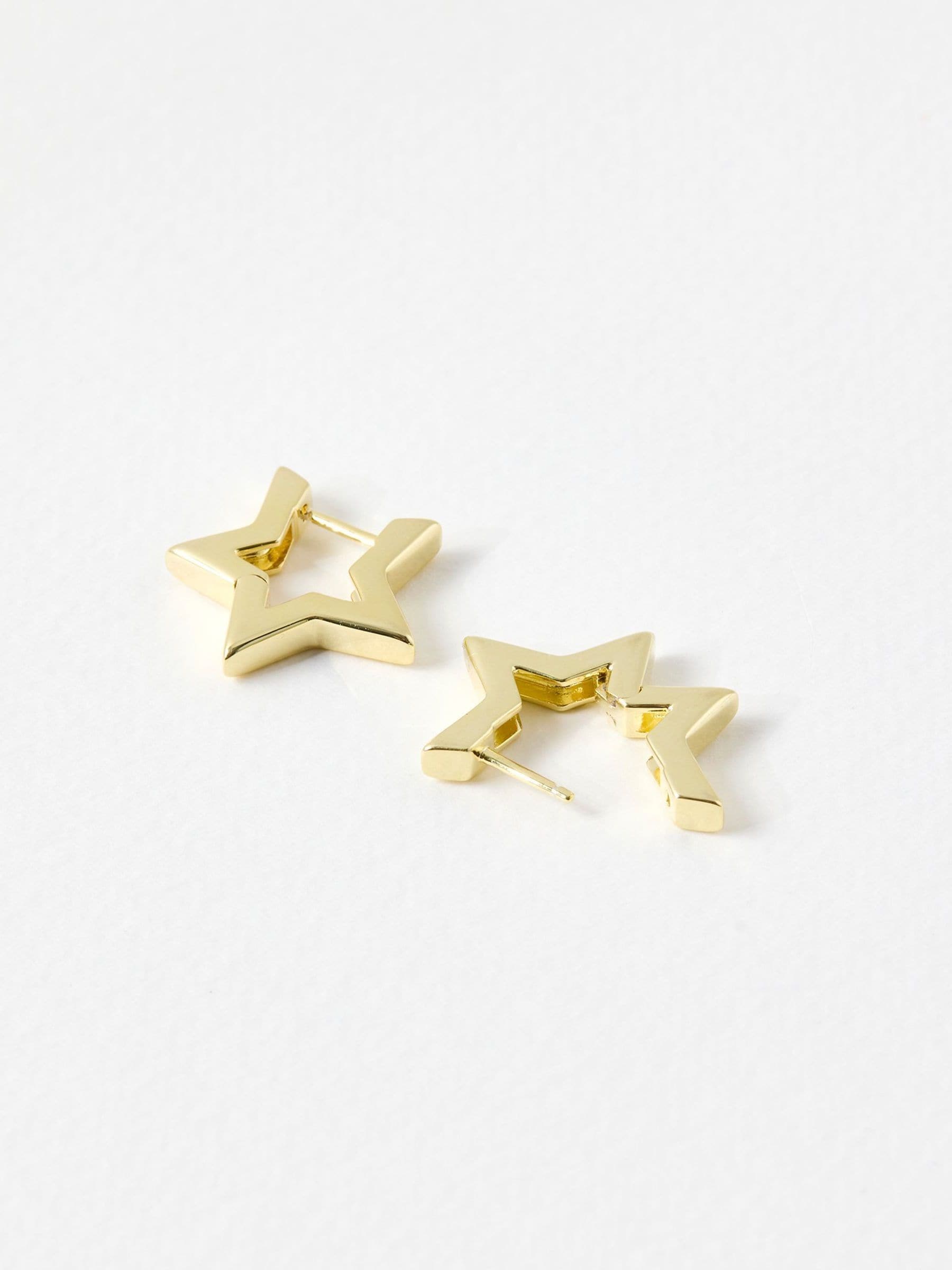 Oliver Bonas gold tone star outline hoop earrings, imported from the UK