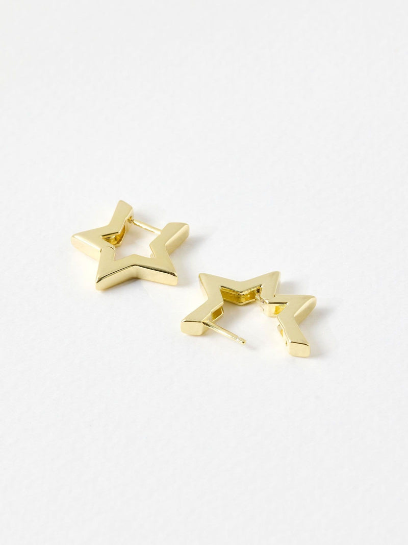 Oliver Bonas gold tone star outline hoop earrings, imported from the UK
