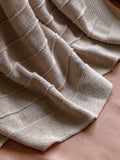 Gallery Home taupe knit throw, imported from the UK