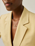 Missoma gold tone T-bar knot pendant necklace, imported from the UK